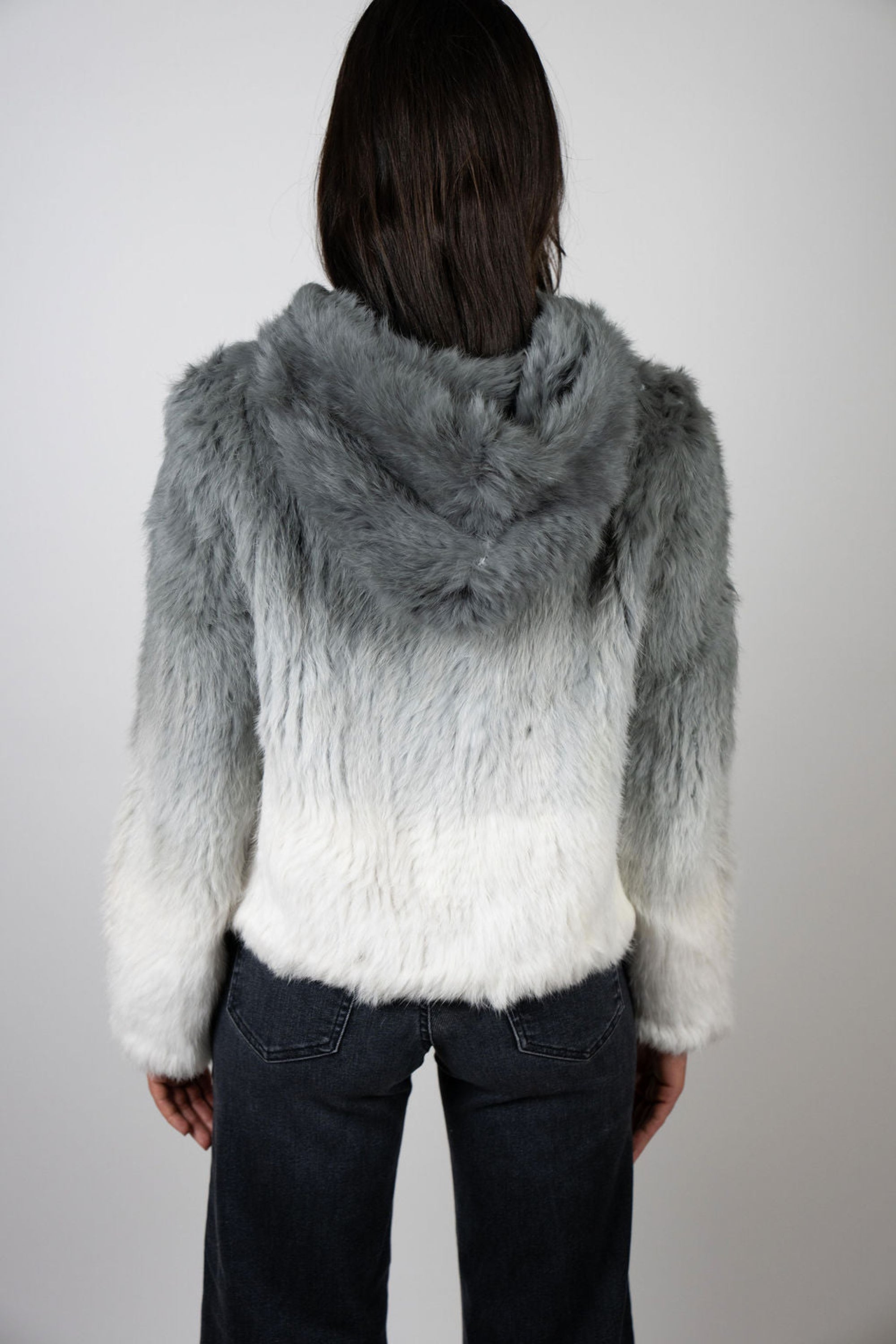 Back view of grey ombre rabbit fur crop jacket with hood