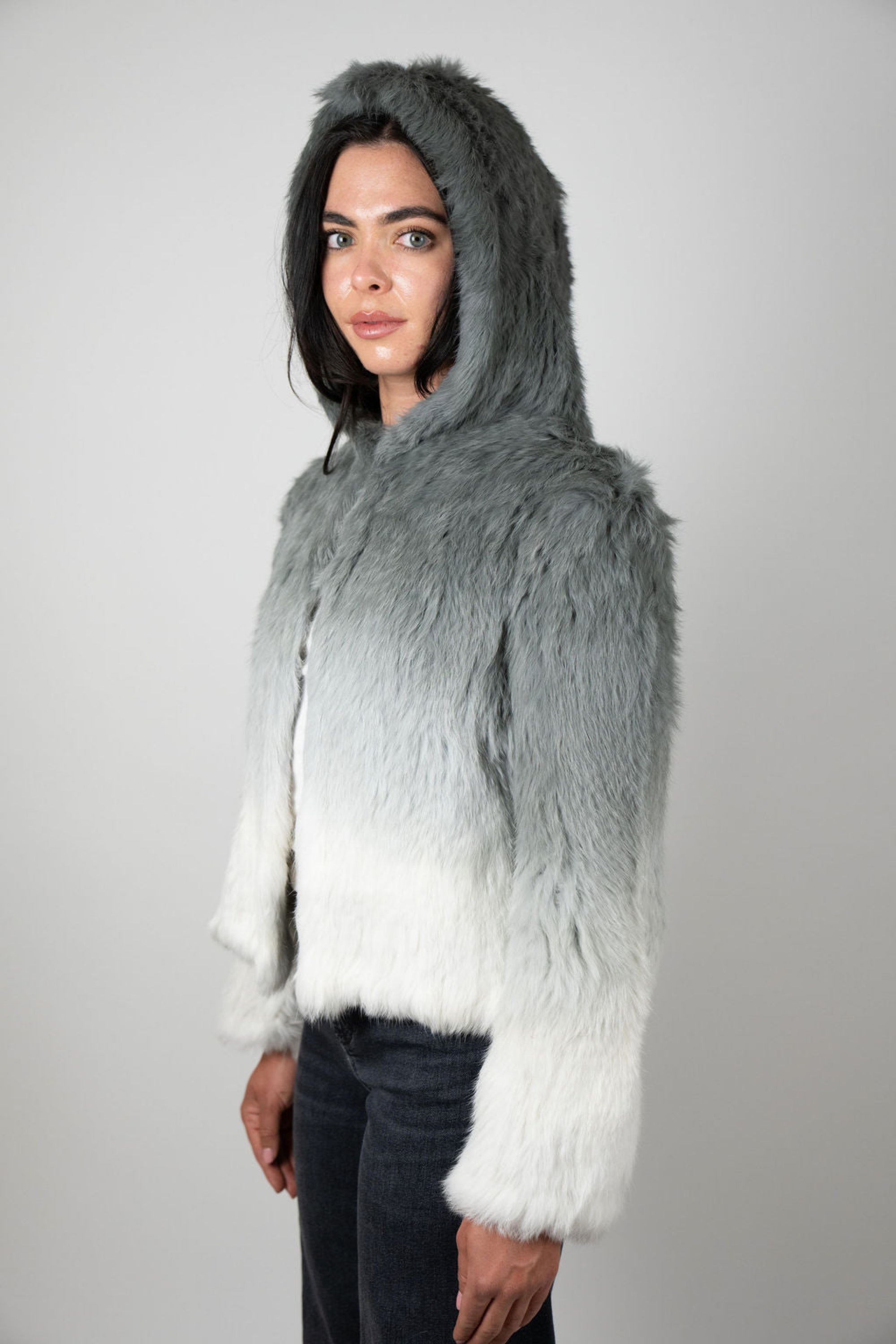 Side view of grey ombre rabbit fur hooded crop jacket on model