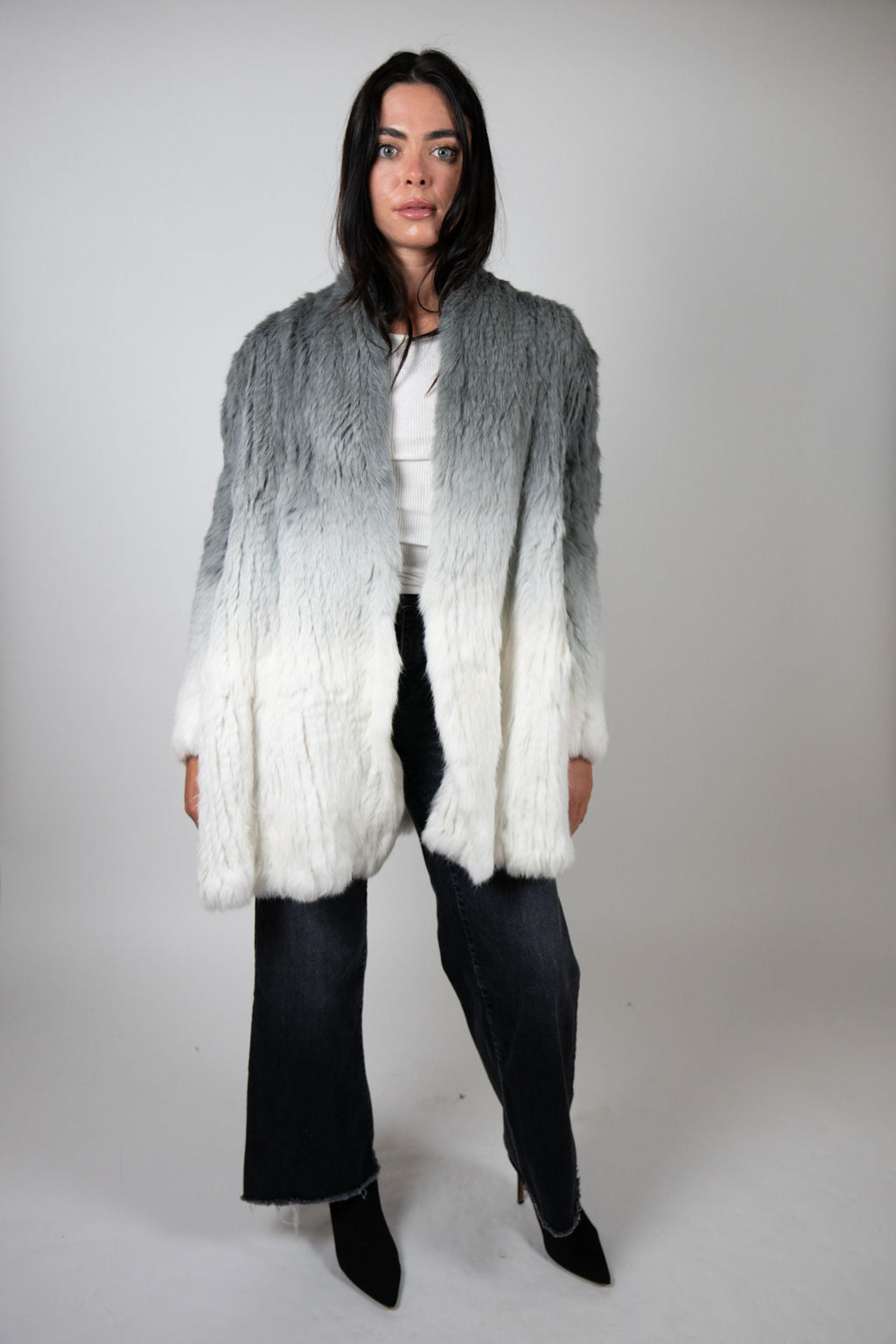 Model wearing grey to white dip dye rabbit fur swing coat front view