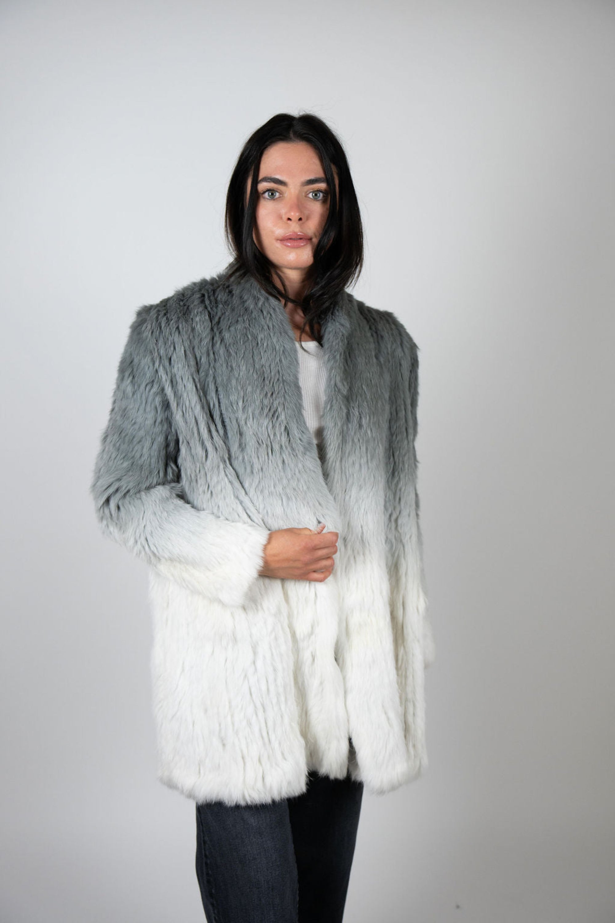 Model front shot of rabbit fur dip dye coat in grey and white tones