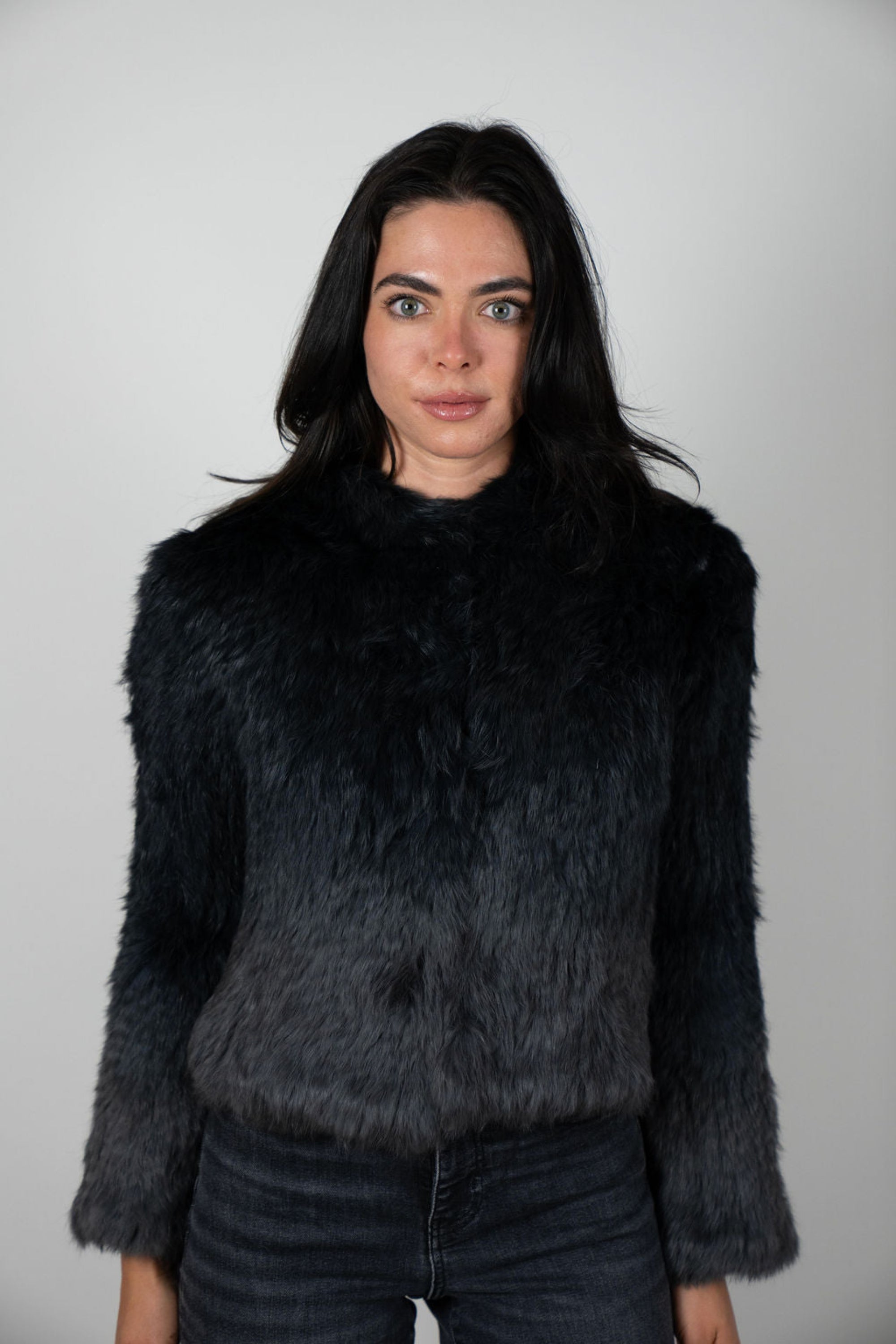 Black and charcoal gradient rabbit hooded crop jacket styled over black top – luxury winterwear by Angel Wings