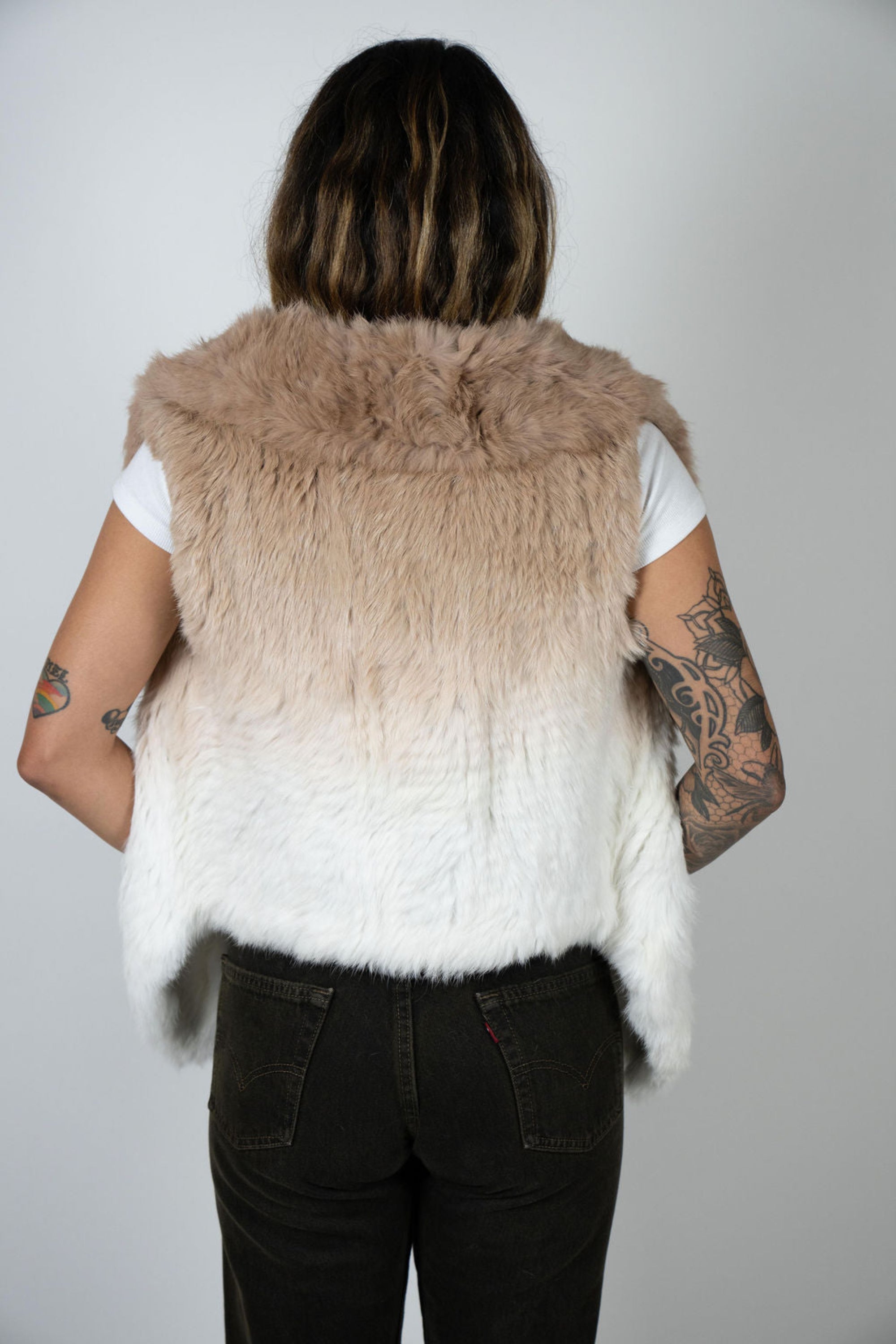Back view of beige to white Angel wings ombre rabbit fur vest