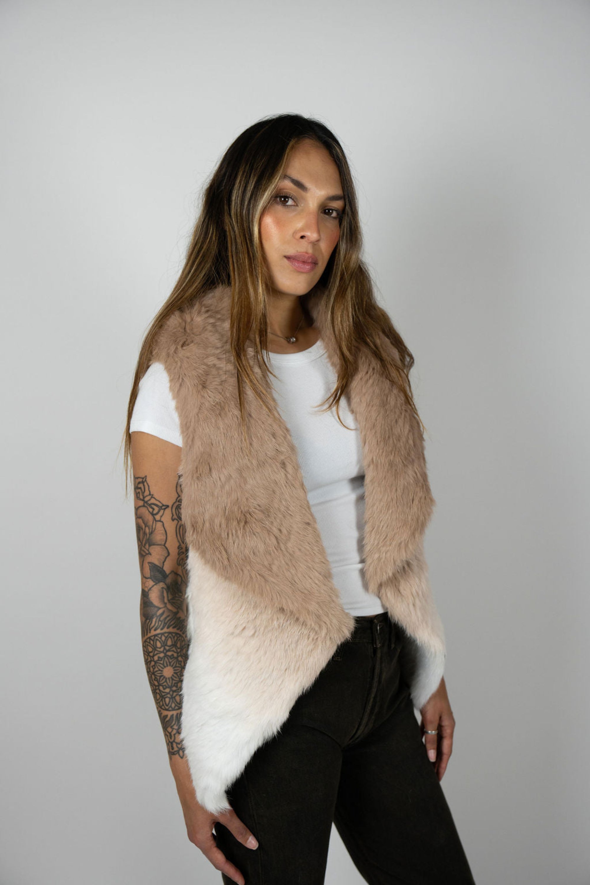 Side profile of model wearing beige ombre rabbit vest
