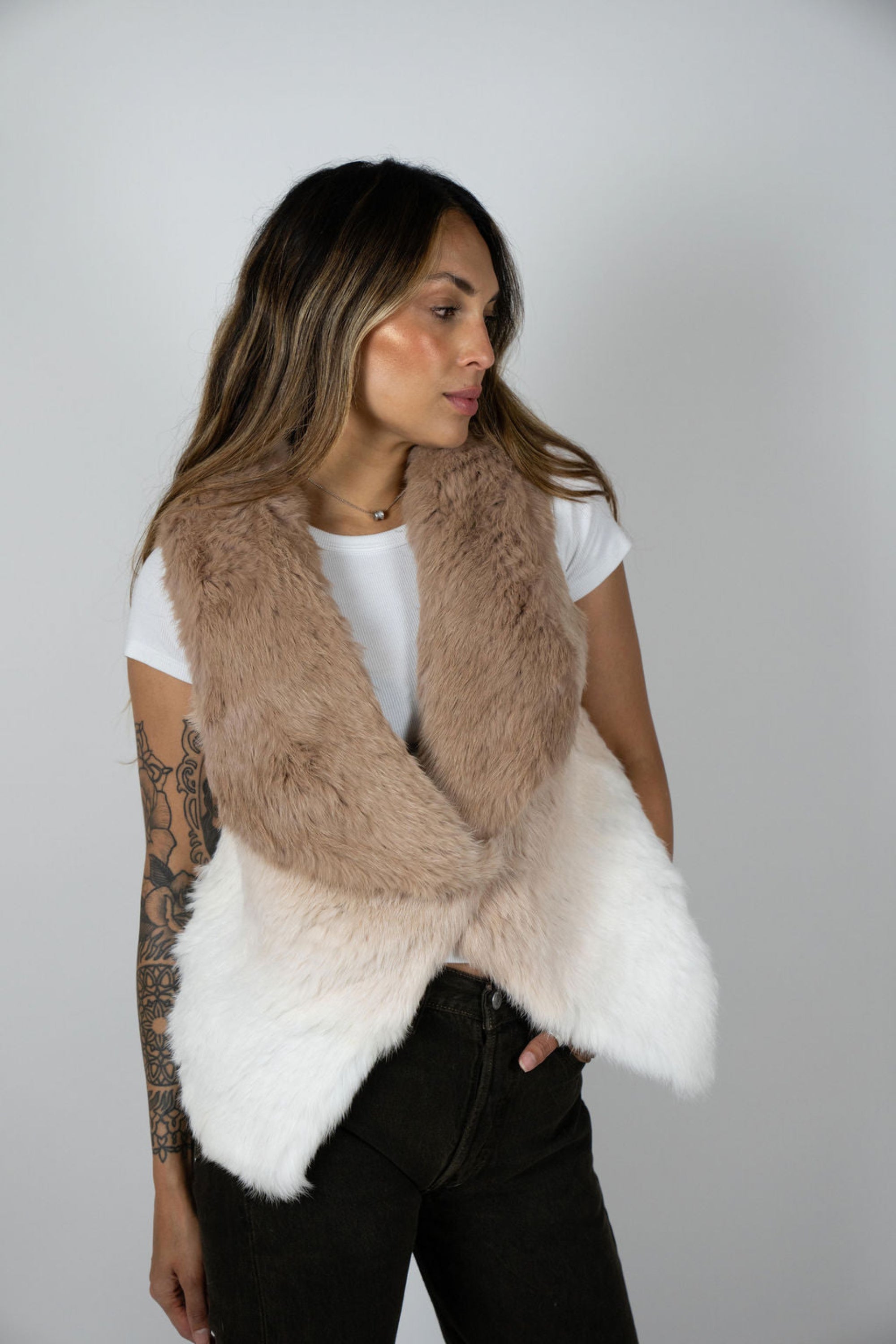 Side profile of model wearing beige ombre rabbit vest
