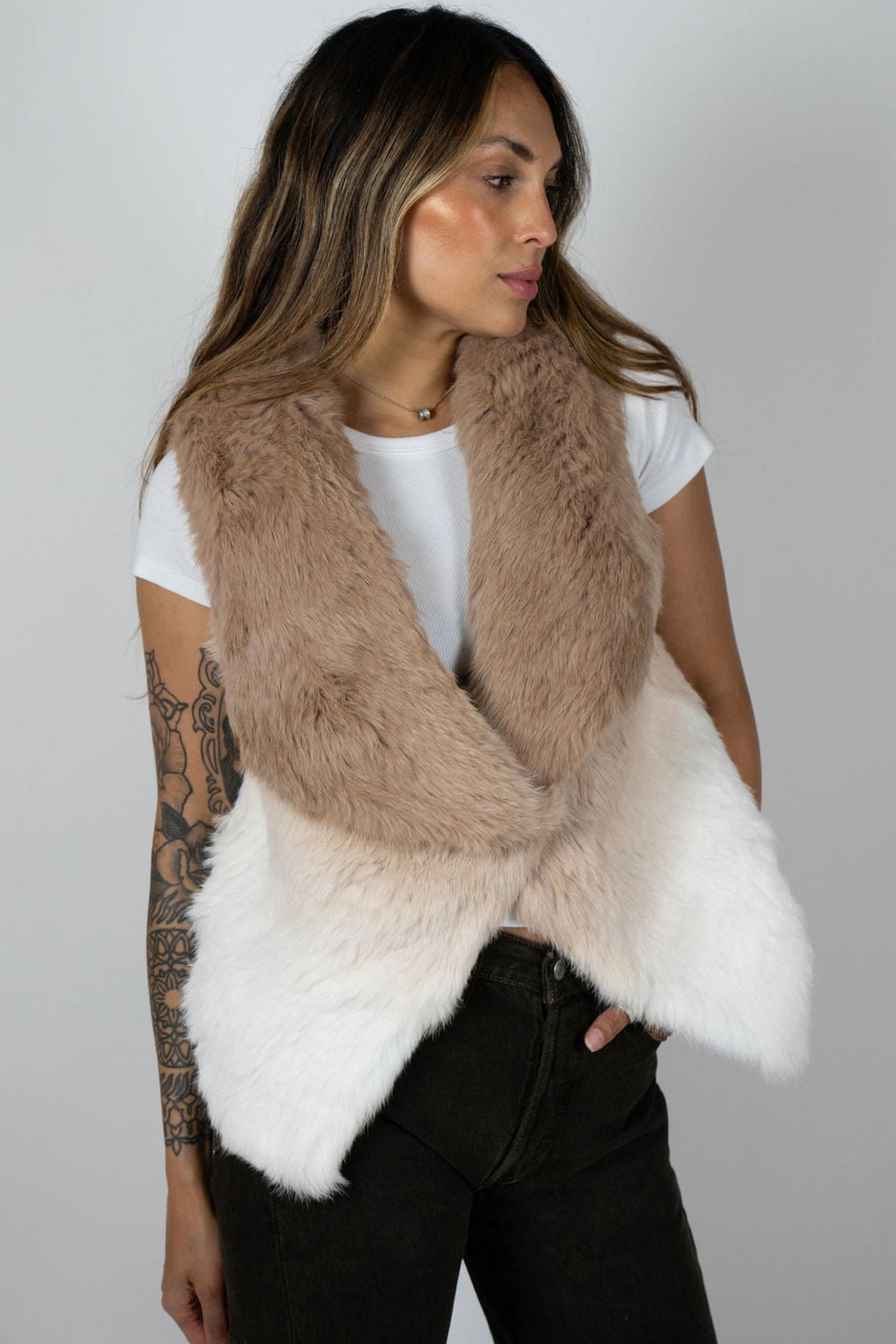 Side profile of model wearing beige ombre rabbit vest