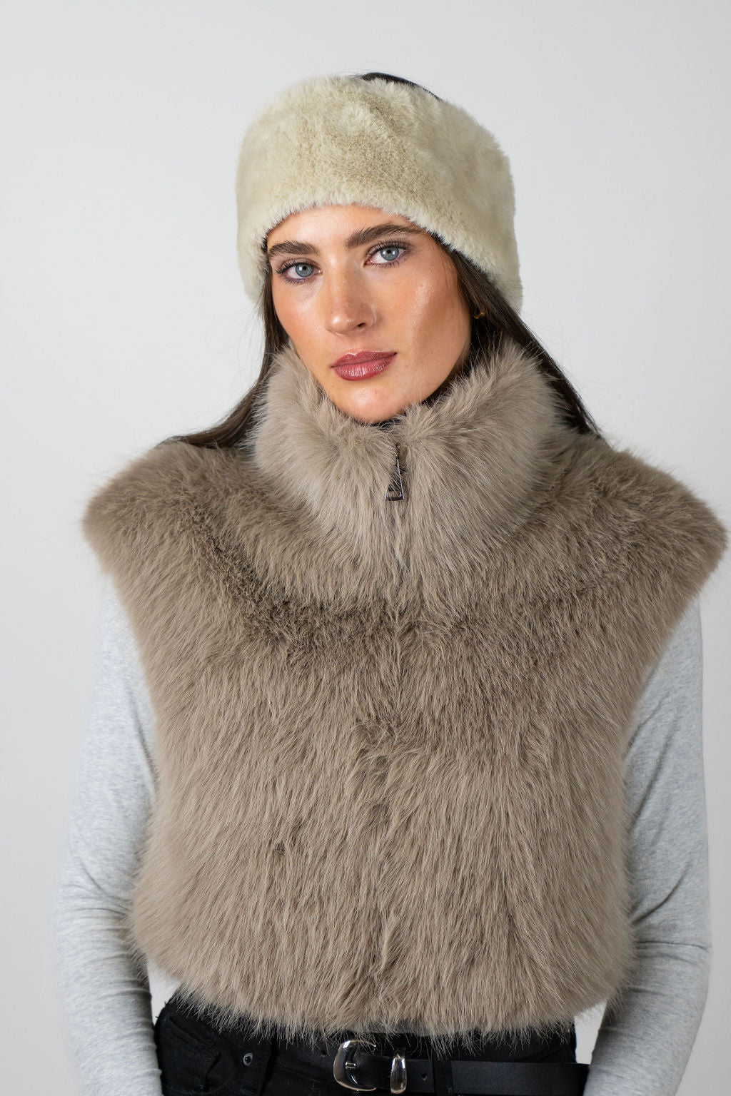 Model wearing the faux fur headband in Beige by Angel Wings by Lucy, styled with a faux fur vest for elevated winter accessorising.