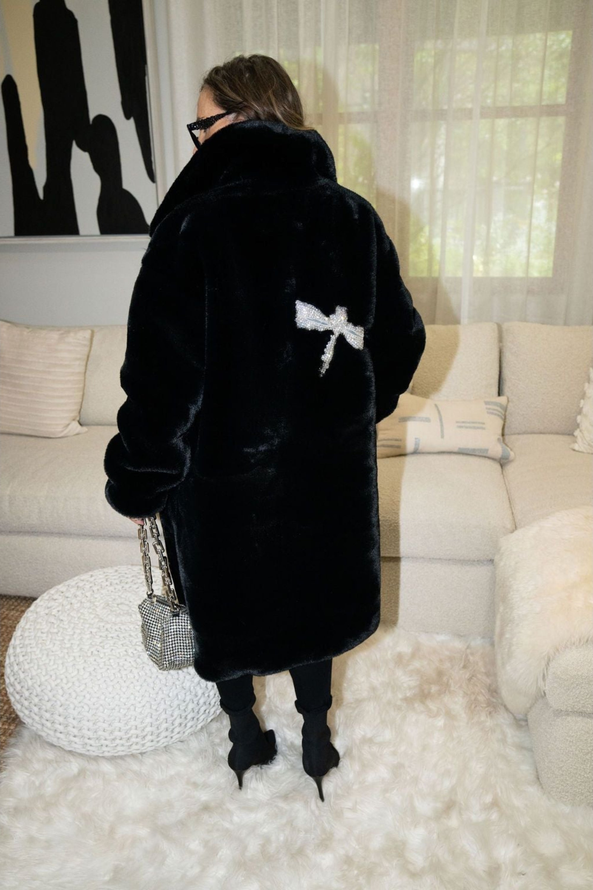 Back view of black faux fur jacket with sparkling crystal dragonfly embellishment — part of the Mr. Greys collection.