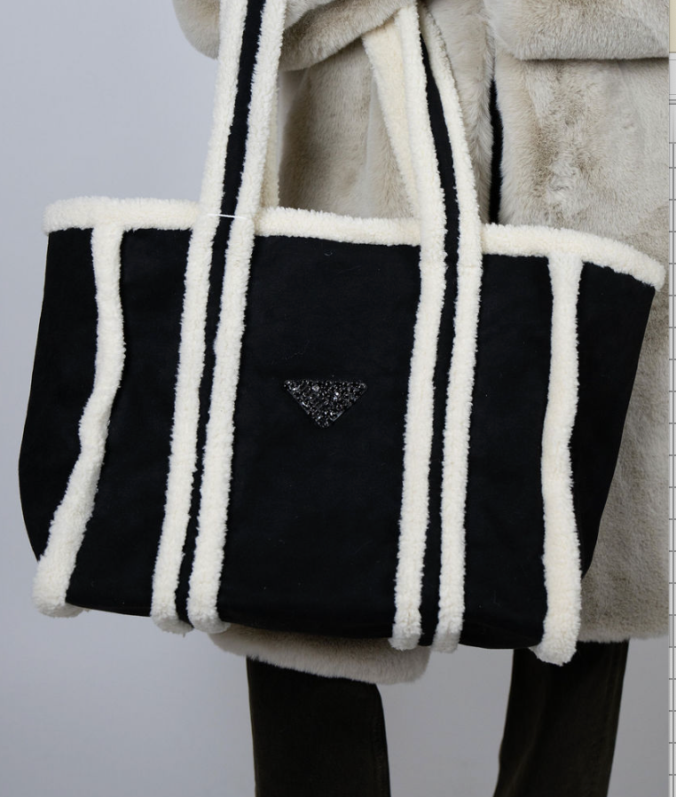 Oversized black faux shearling tote bag with cream trim and Angel Wings triangle emblem – Alpine Tote by Angel Wings by Lucy