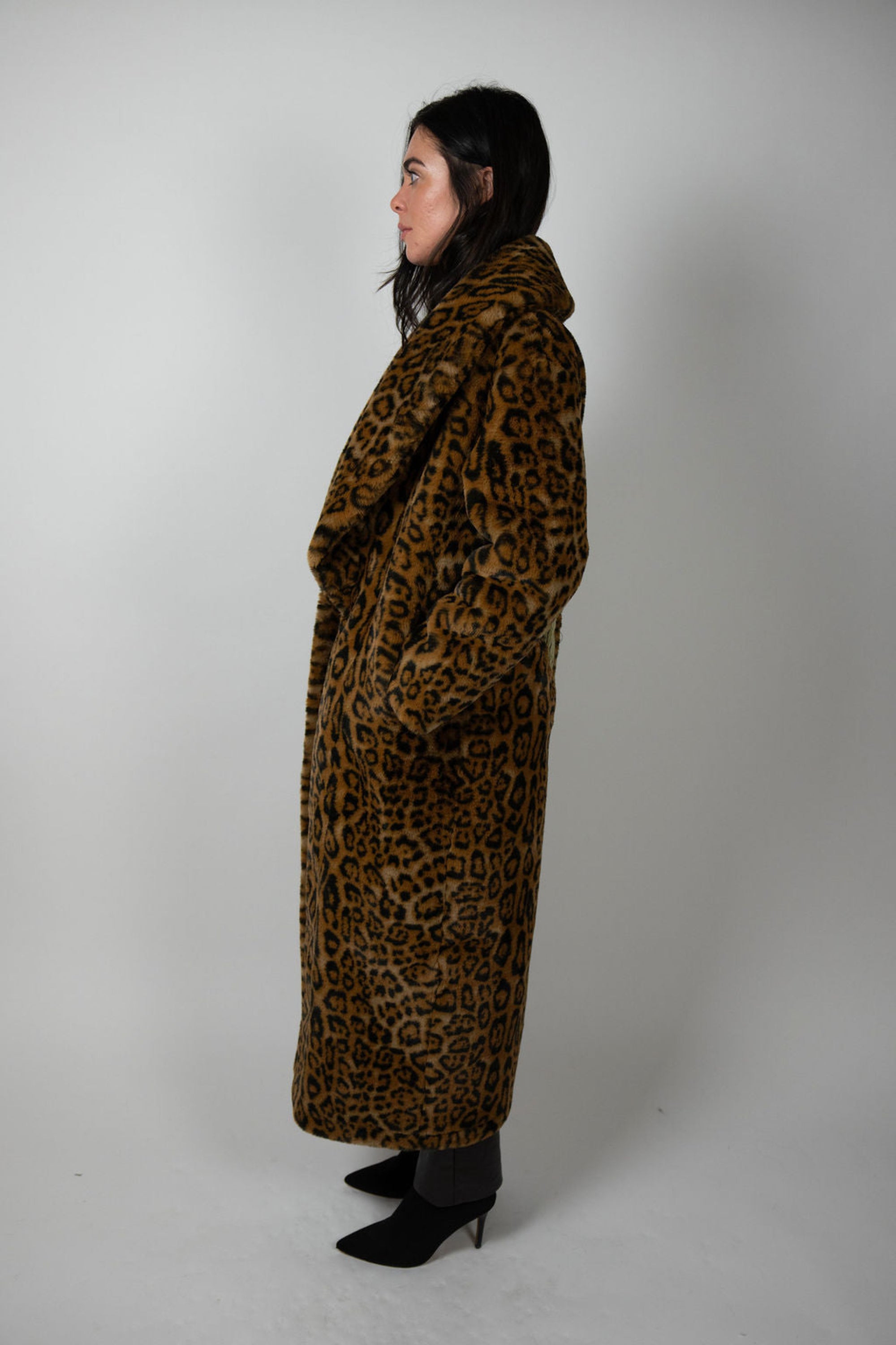 Side profile of model wearing Ajax Jacket by Angel Wings by Lucy – silver angel wing detail