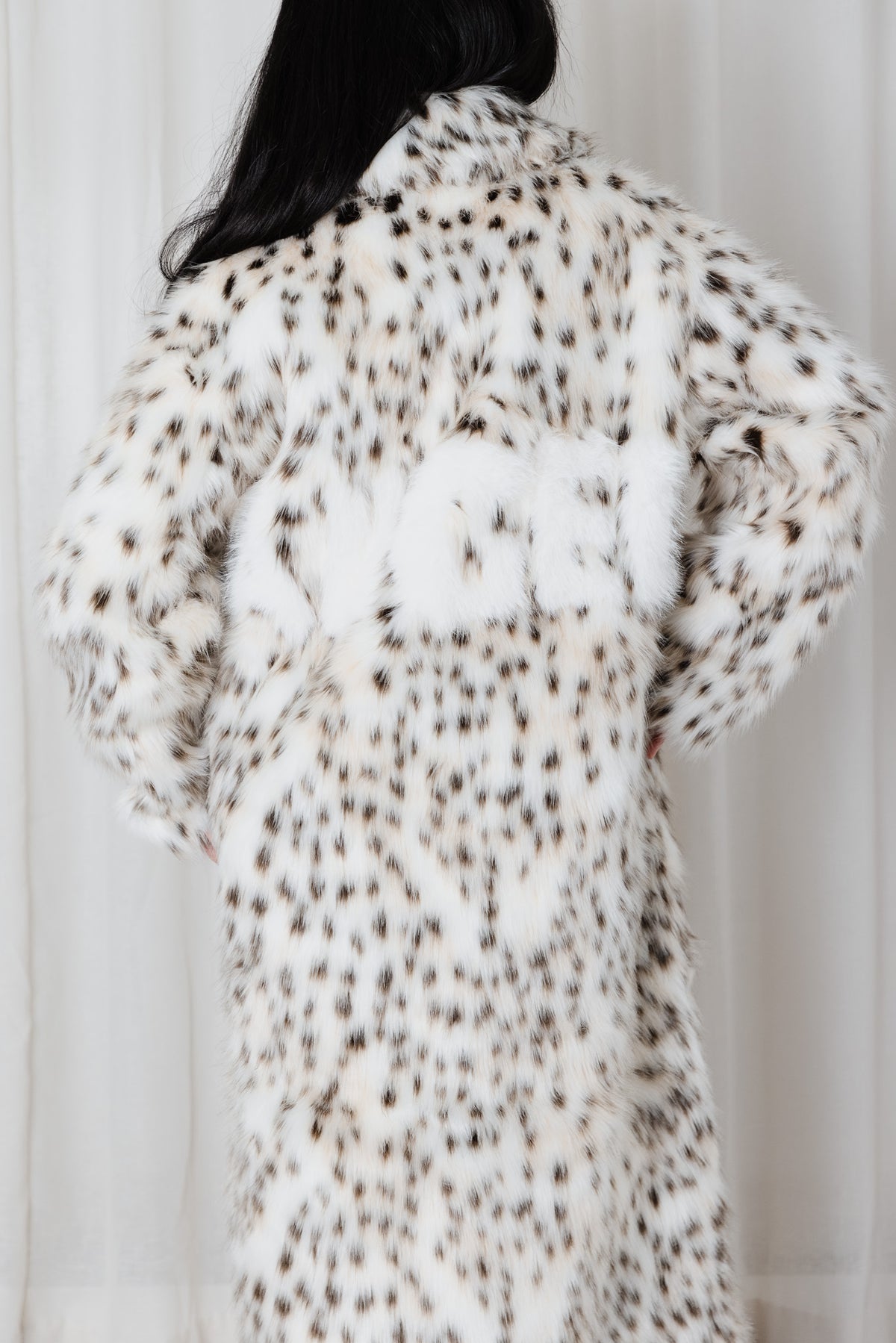 Back view of Angel Wings Angel Animal Snow Leopard faux-fur long coat with subtle angel motif.