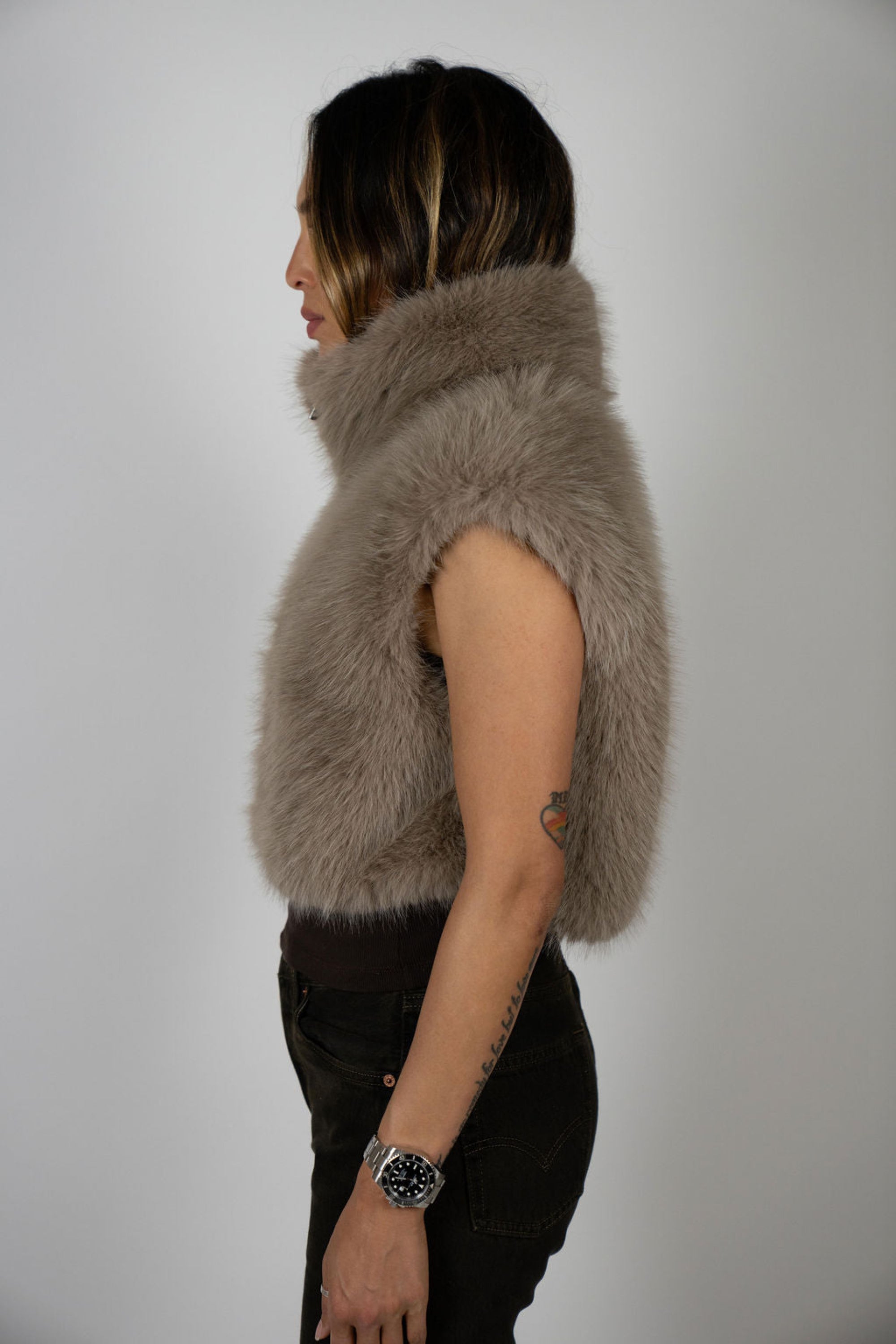 Side profile of model in Angel Wings by Lucy Moon Rabbit Crop Vest – high-end faux fur sleeveless jacket