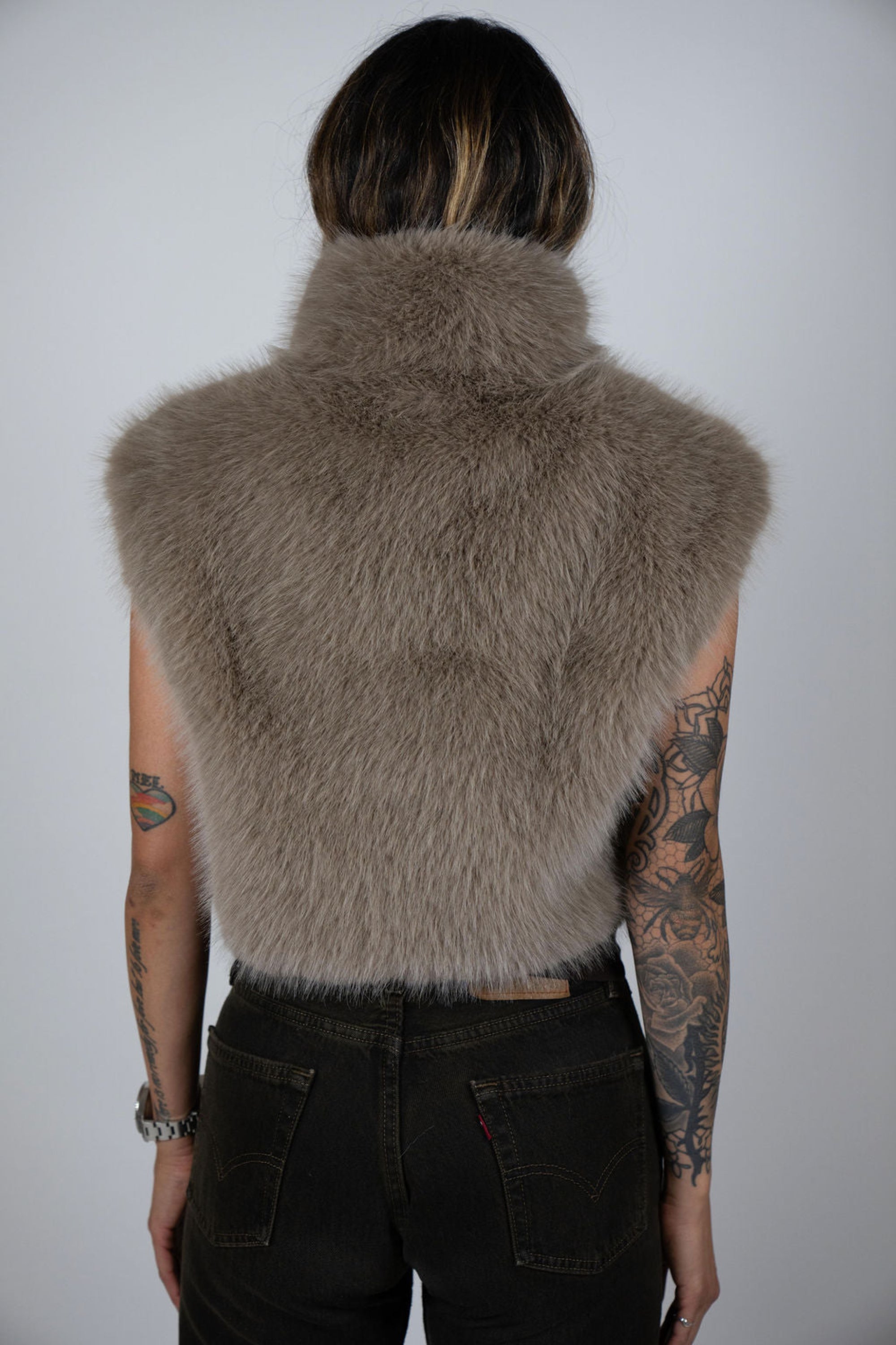 Rear view of model wearing Angel Wings by Lucy Moon Rabbit Crop Vest – cropped luxury outerwear for women