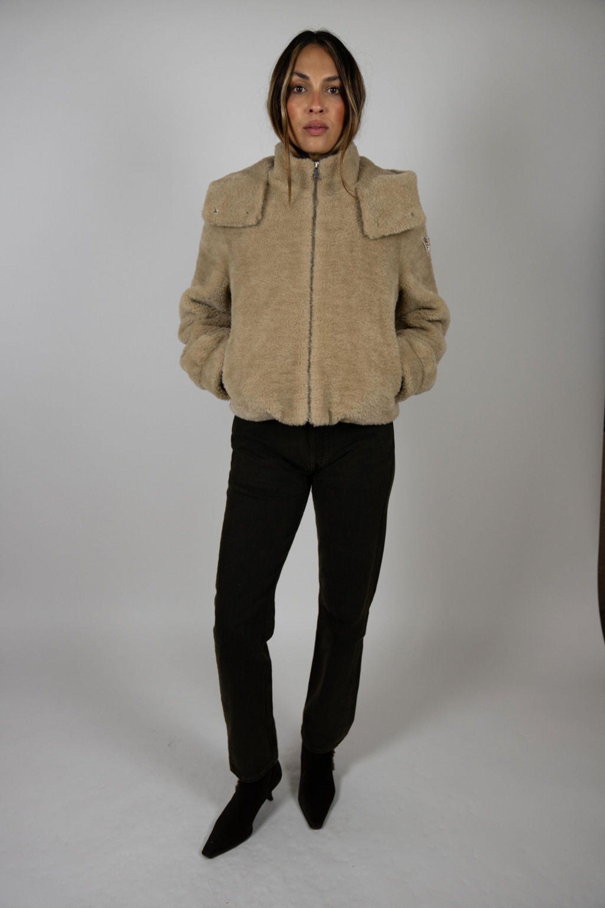 Model wearing Angel Wings by Lucy Slope Room Faux Fur Bomber – stylish women’s ski and après-ski outerwear