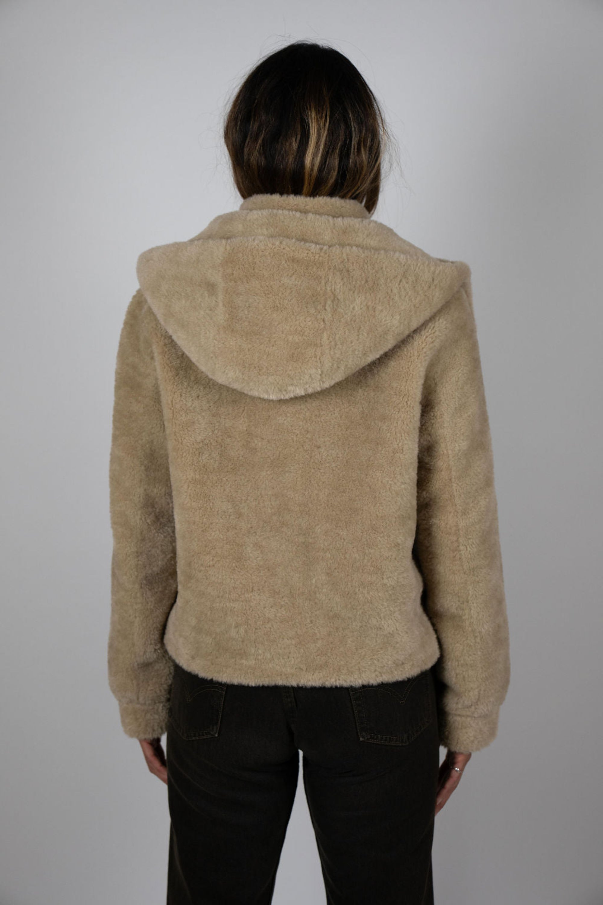 Rear view of model wearing Angel Wings by Lucy Slope Room Faux Fur Bomber – hooded faux fur bomber style