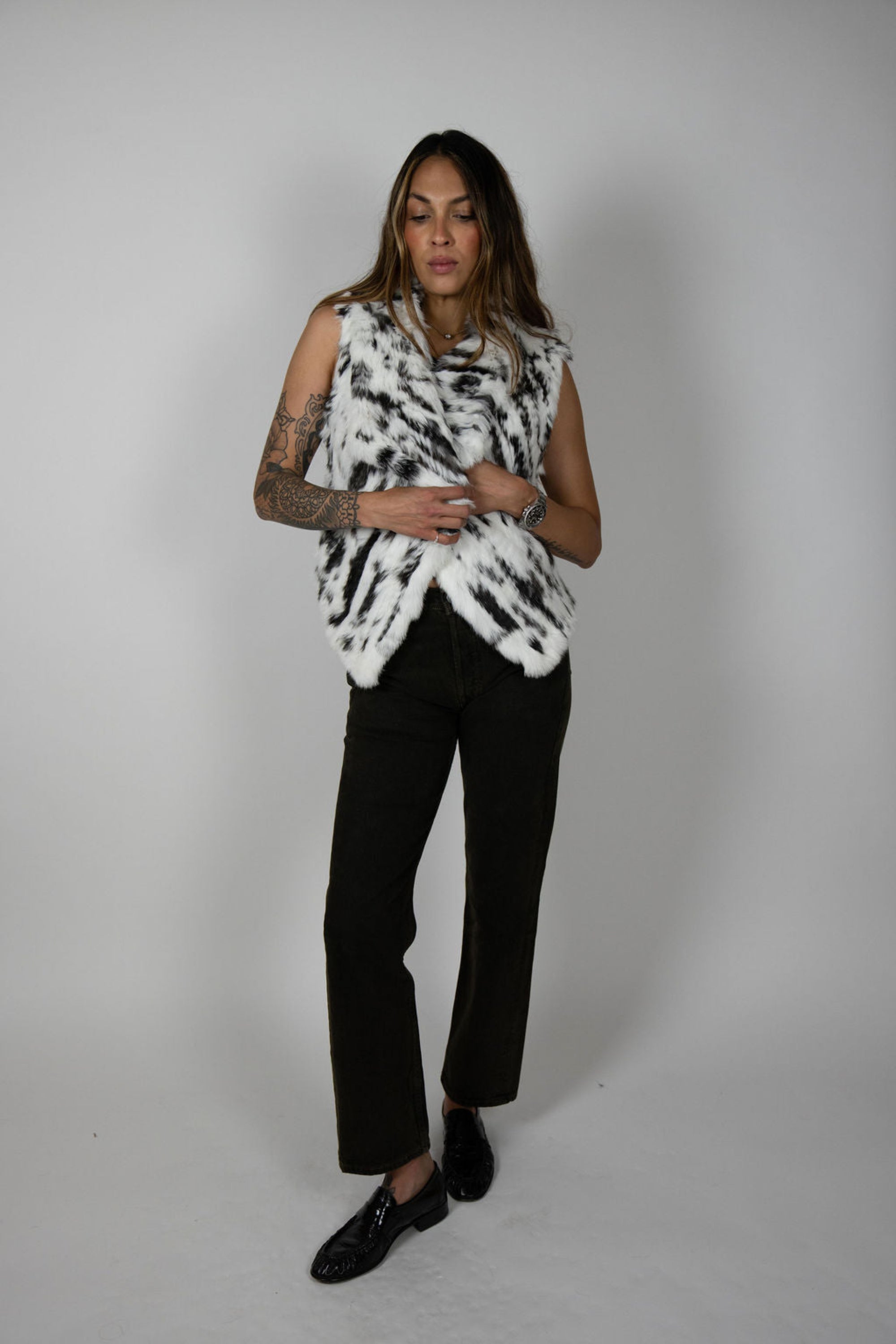 Angel Wings by Lucy rabbit fur vest in snow leopard print, sleeveless with high collar, shown on model.