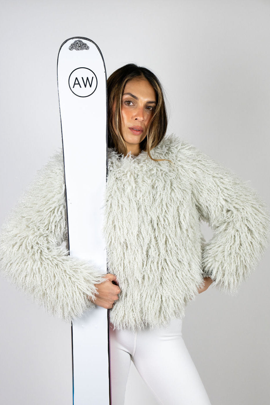 Angel Wings Yeti Jacket in Grey styled with white pants and Angel Wings skis.