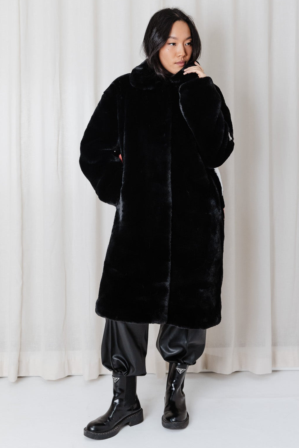 Front view of Angel Wings Mr Grey Love Skull long black faux-fur coat.