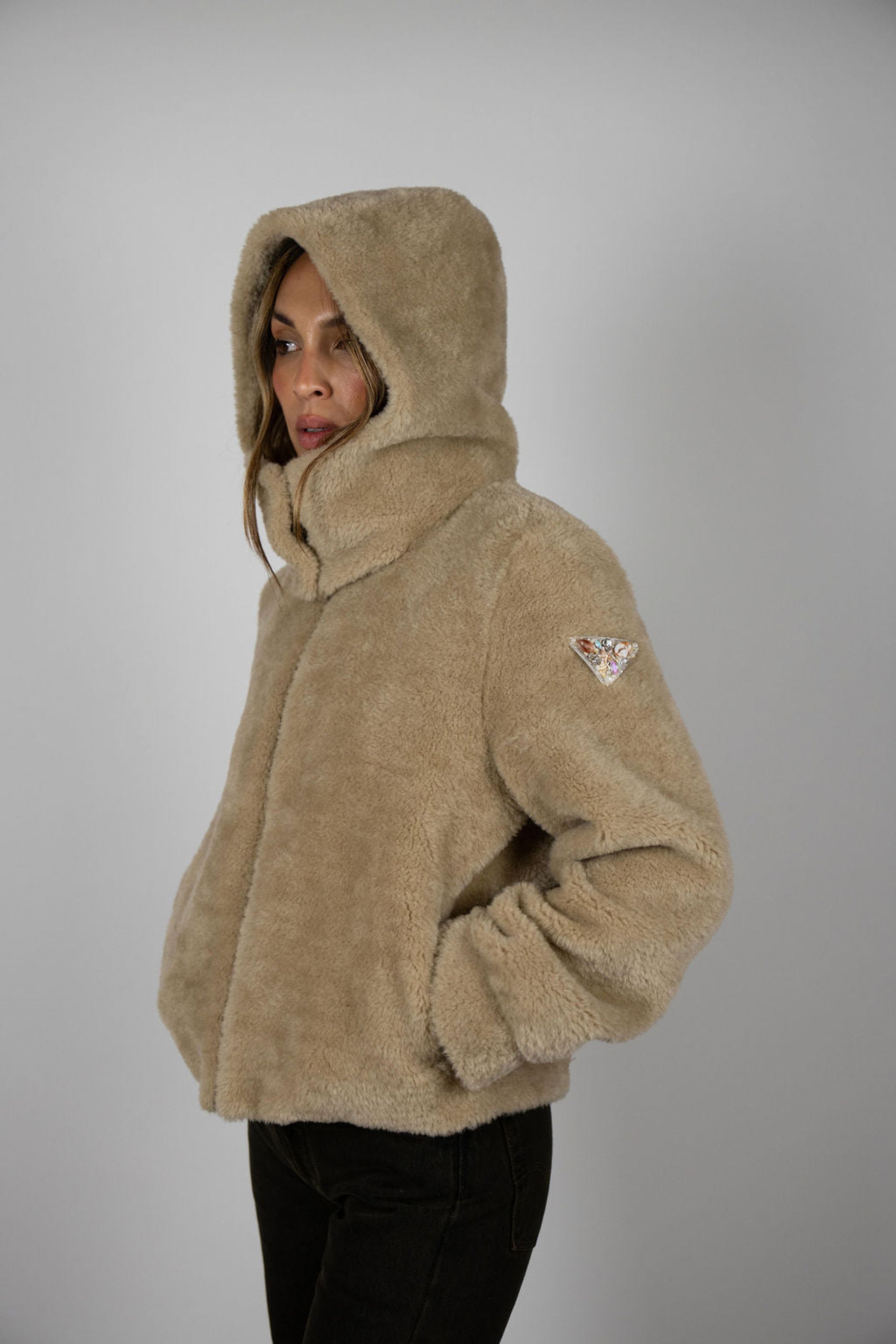 Model wearing Angel Wings by Lucy Slope Room Faux Fur Bomber – hooded faux fur bomber style