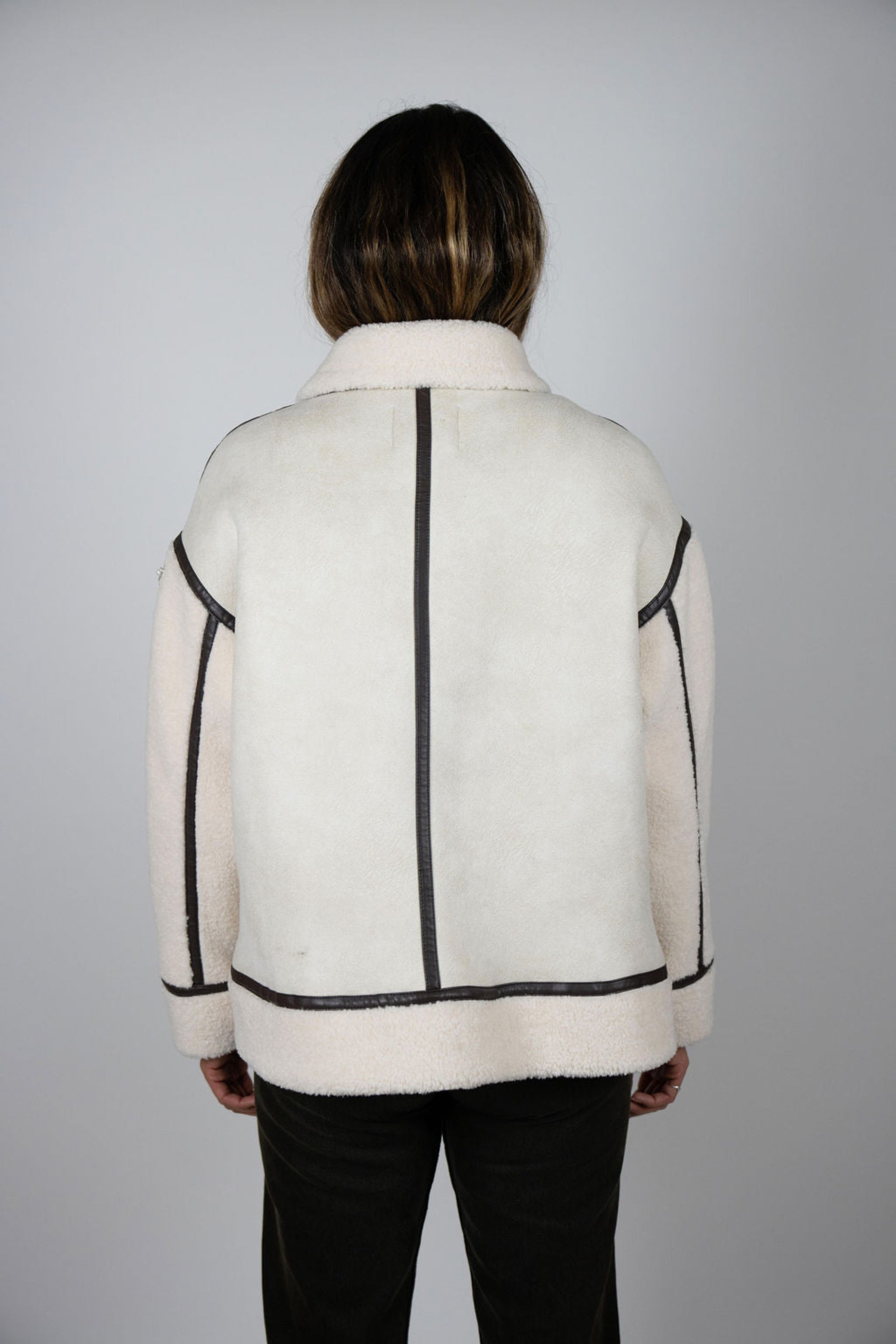 Back view of model wearing Angel Wings by Lucy cream and cocoa Vandetta shearling jacket