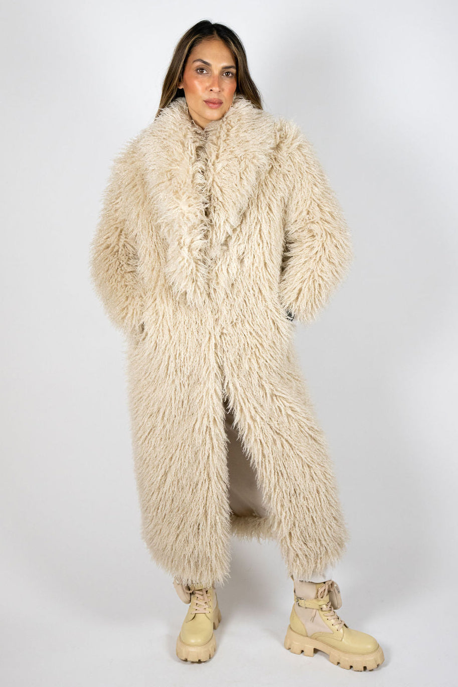 Full-length Angel Wings Yeti Coat in Oat showing its long shaggy faux-fur silhouette.