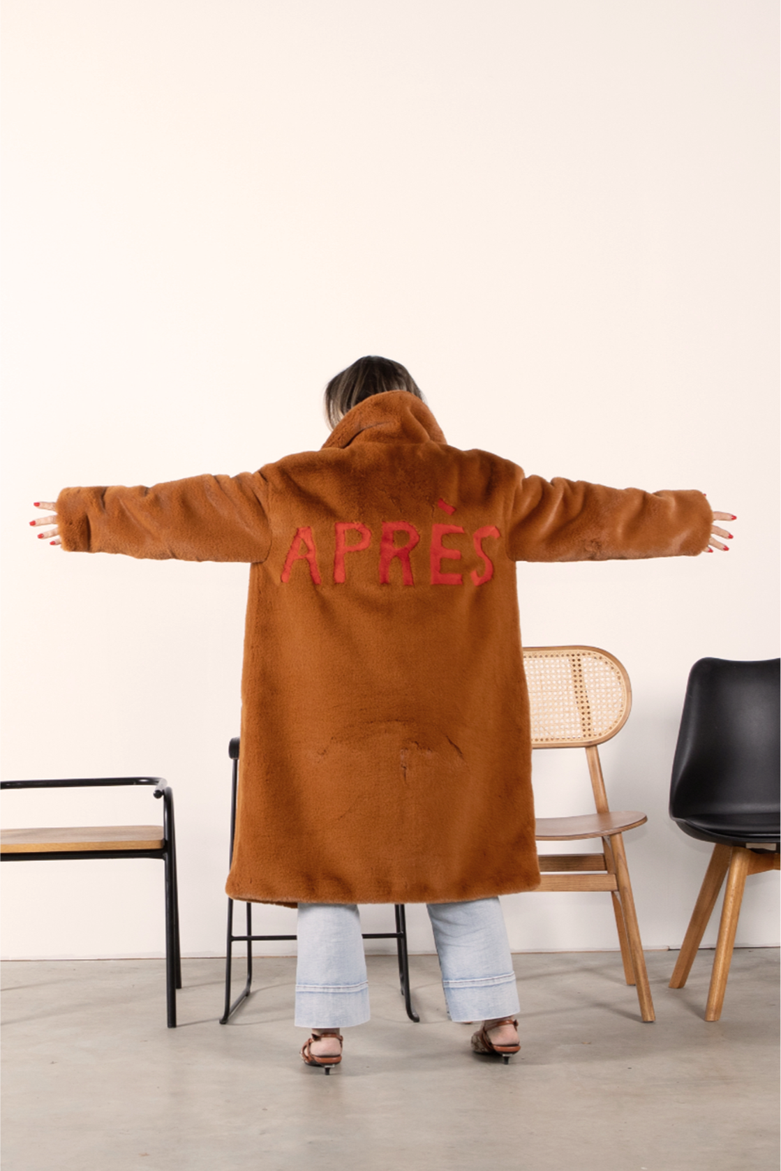 Back view of caramel faux fur jacket with bold red “APRÈS” lettering — part of the Mr. Greys après-ski collection.