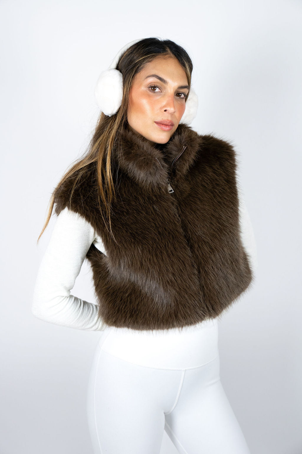 Luxury brown faux fur vest for women styled for après ski fashion