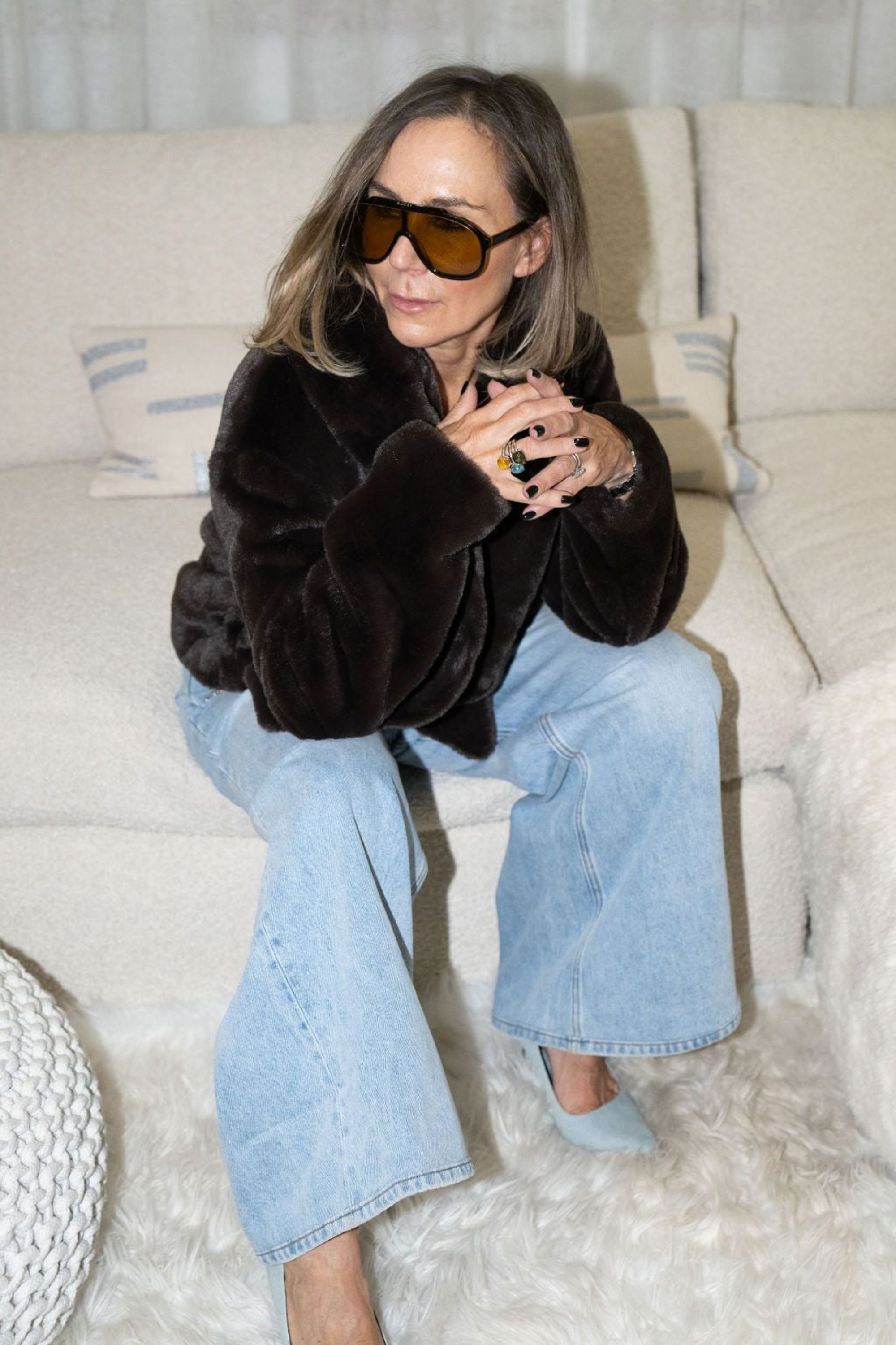 Lucy MacGill from Angel Wings seated in the Bear Den Crop in Choc by Angel Wing, wearing her gucci sunglasses