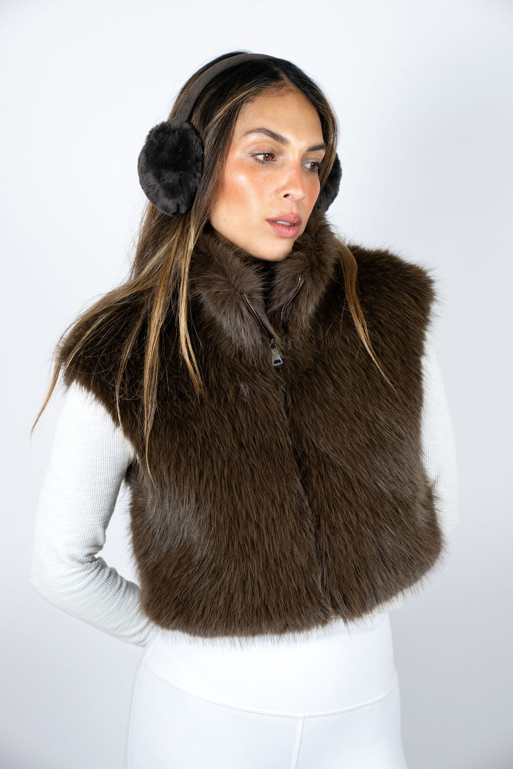 Luxury brown faux fur vest for women styled for après ski fashion