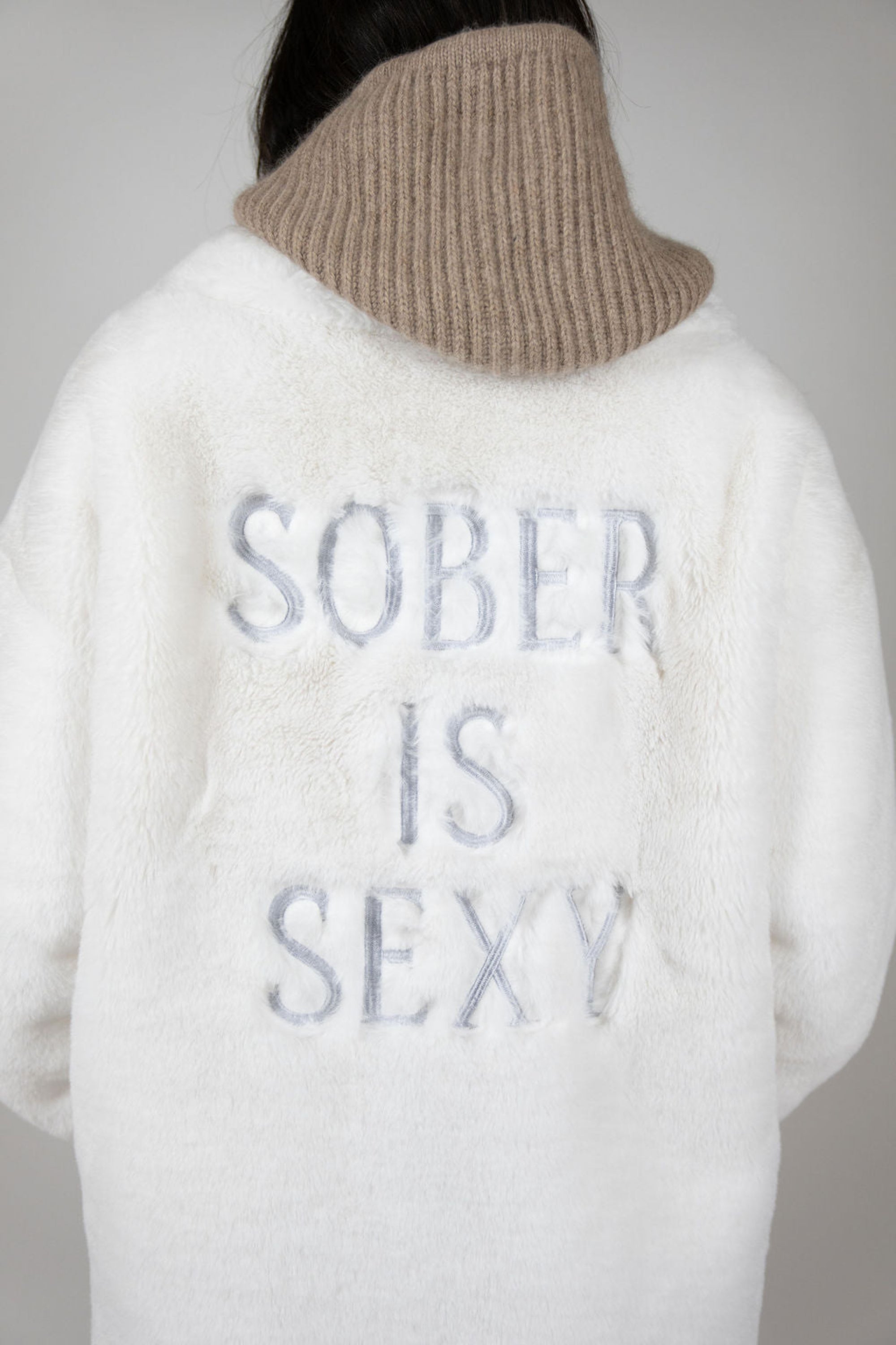 Back view of oversized white faux fur jacket with relaxed fit and soft texture – Mr Greys by Angel Wings by Lucy