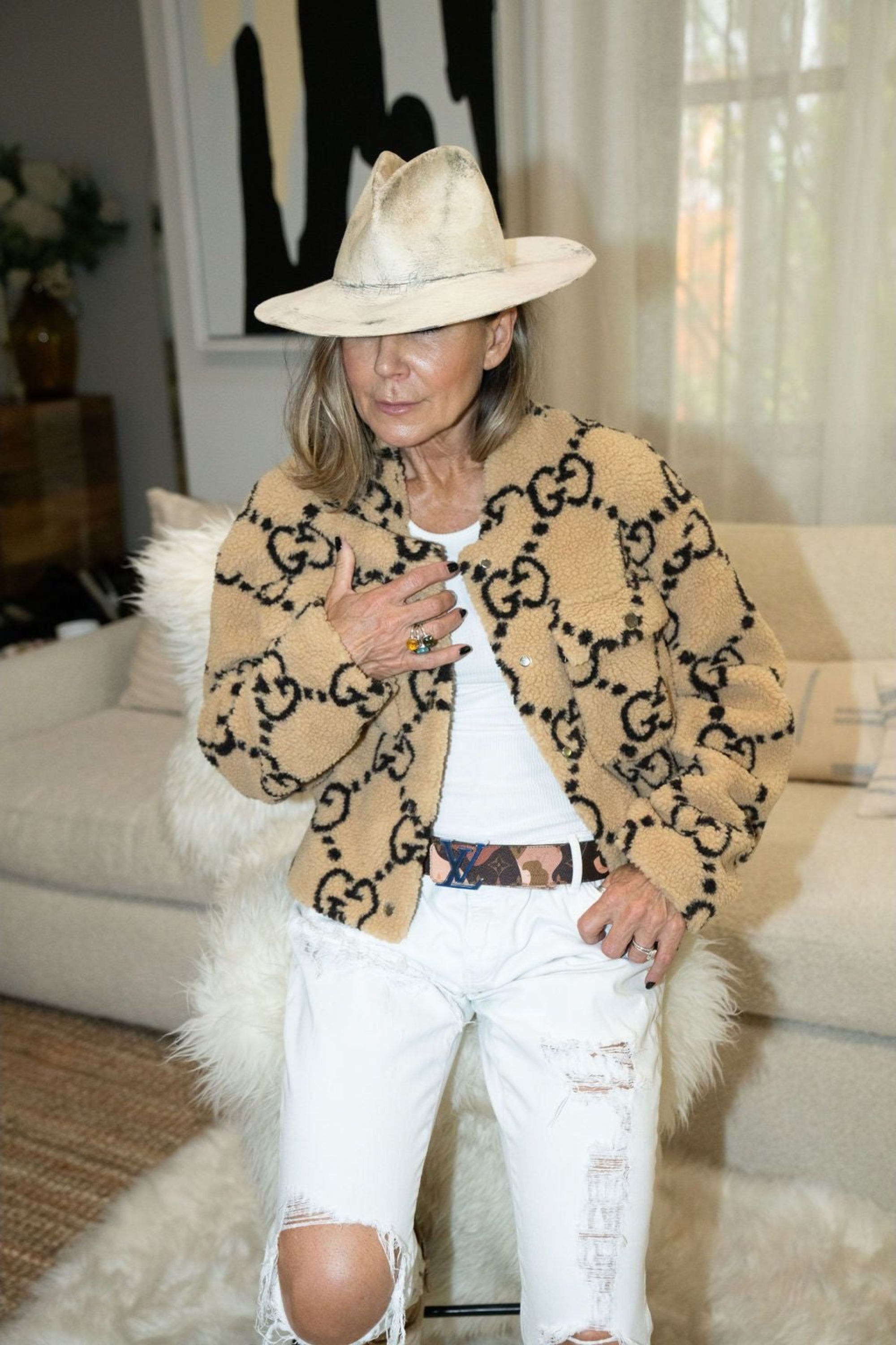 Woman wearing oversized beige faux shearling bomber jacket with bold black print – Maru Bomber by Angel Wings by Lucy
