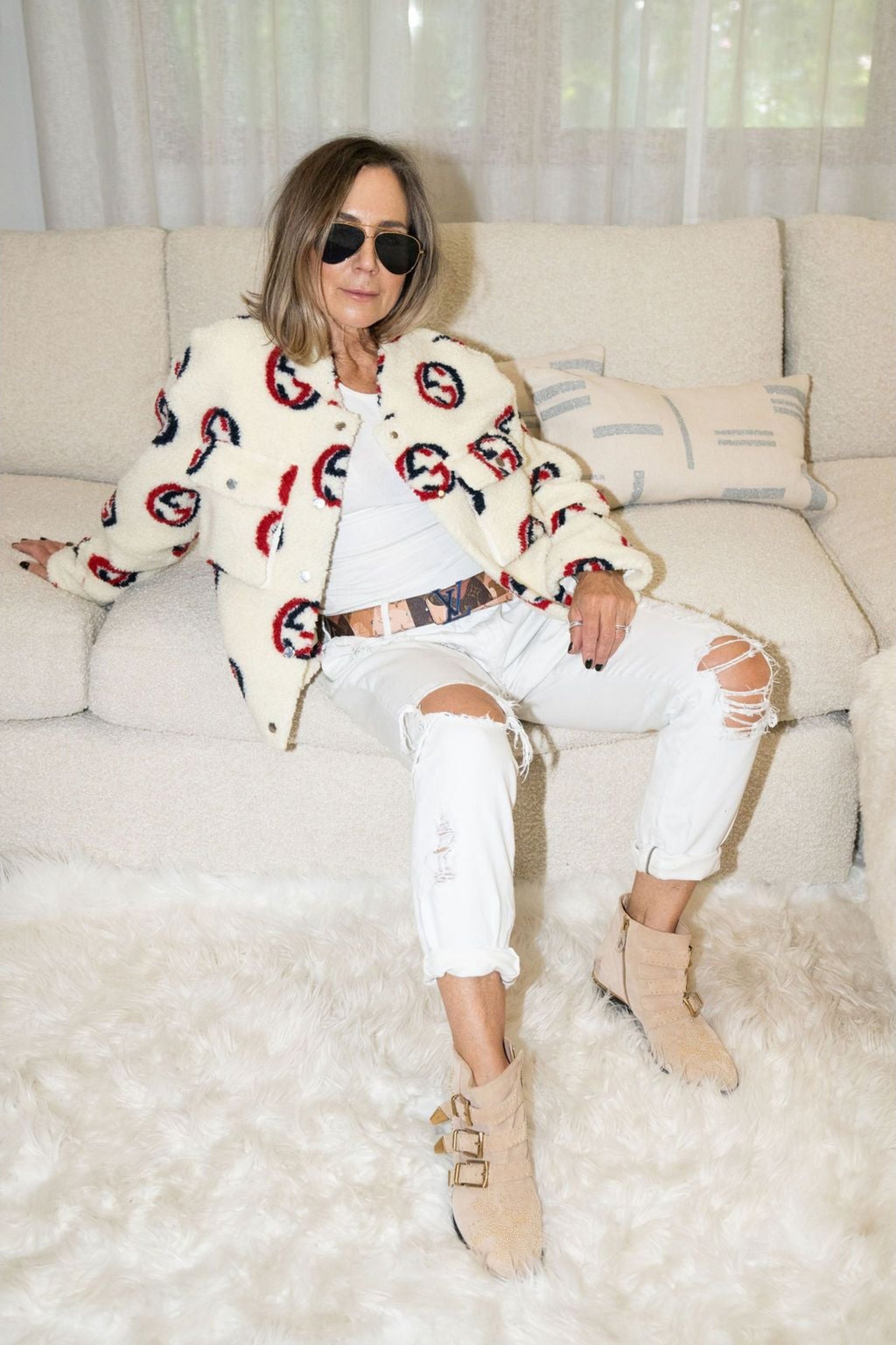 Woman wearing cream faux shearling bomber jacket with red and navy graphic print – Maru Bomber by Angel Wings by Lucy