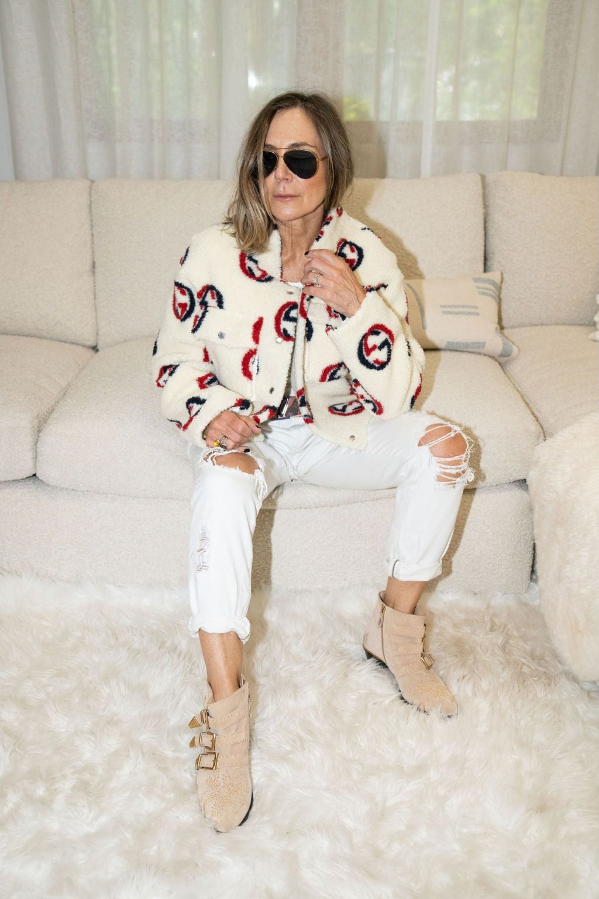 Woman wearing cream faux shearling bomber jacket with red and navy graphic print – Maru Bomber by Angel Wings by Lucy