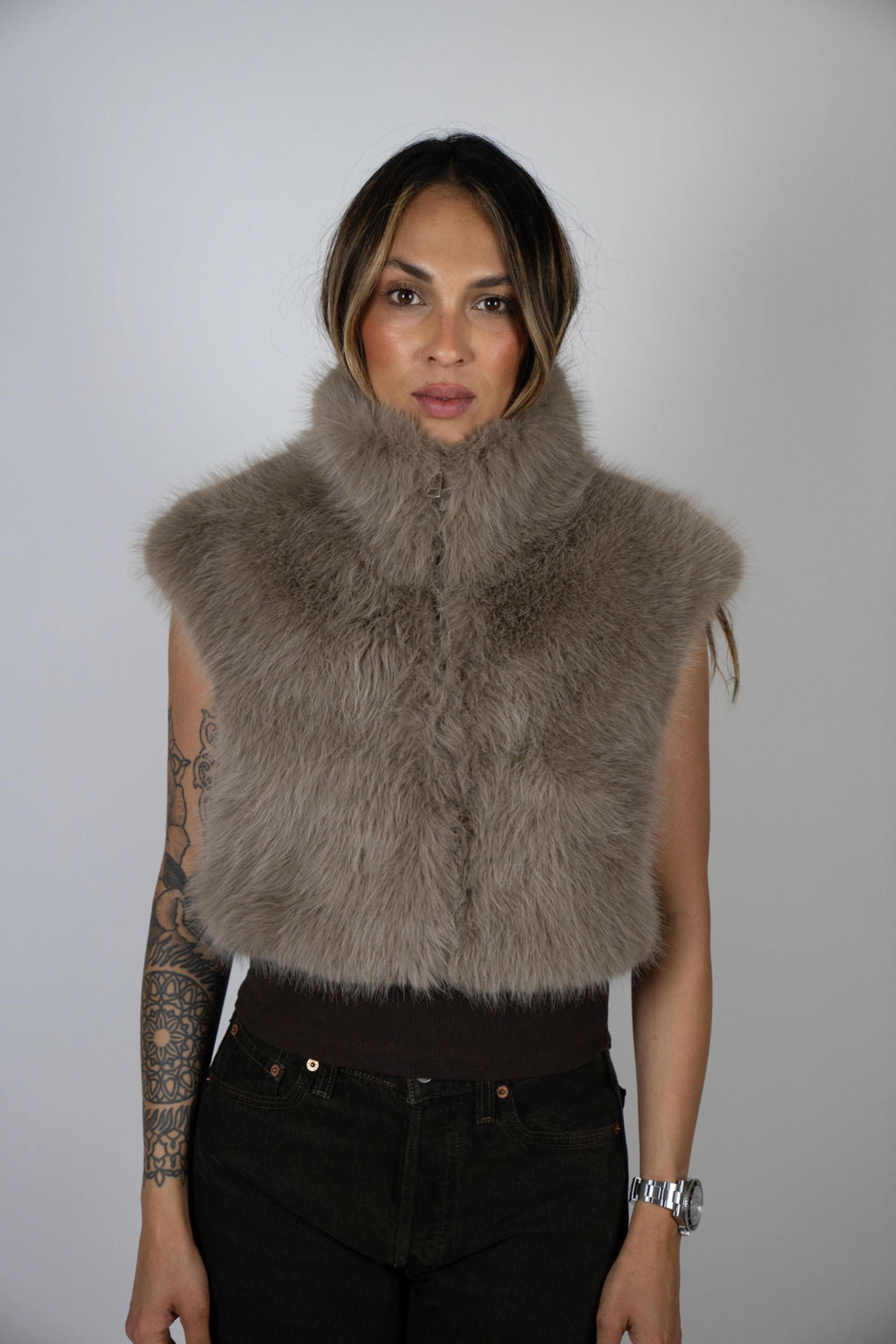 Model wearing the Moon Rabbit faux fur crop vest by Angel Wings by Lucy, a luxury sleeveless statement piece designed for elevated winter and resort styling.