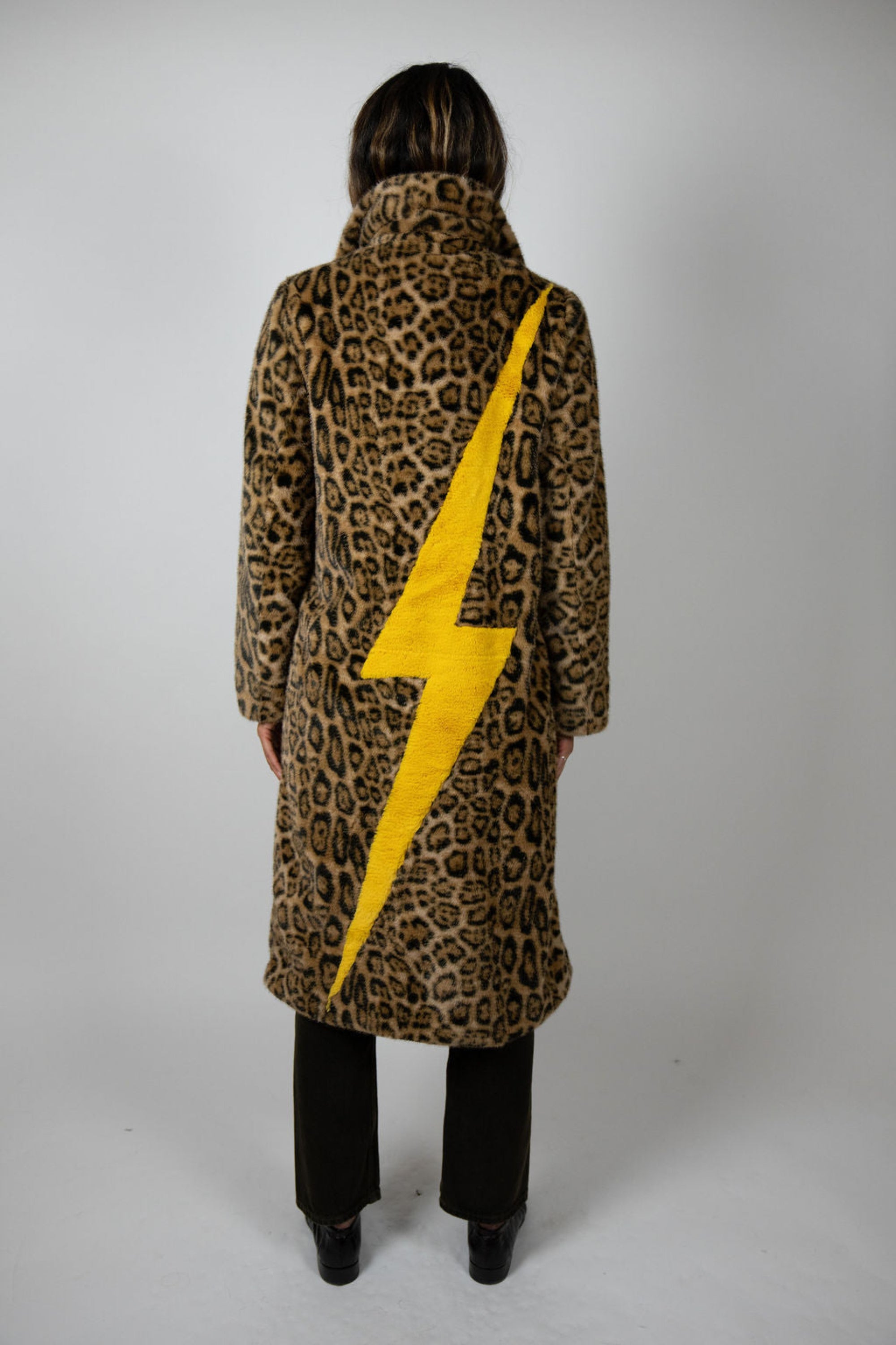 Back view of the Mr Greys Leopard Lightning faux fur coat by Angel Wings by Lucy, featuring a statement yellow lightning bolt on leopard print.