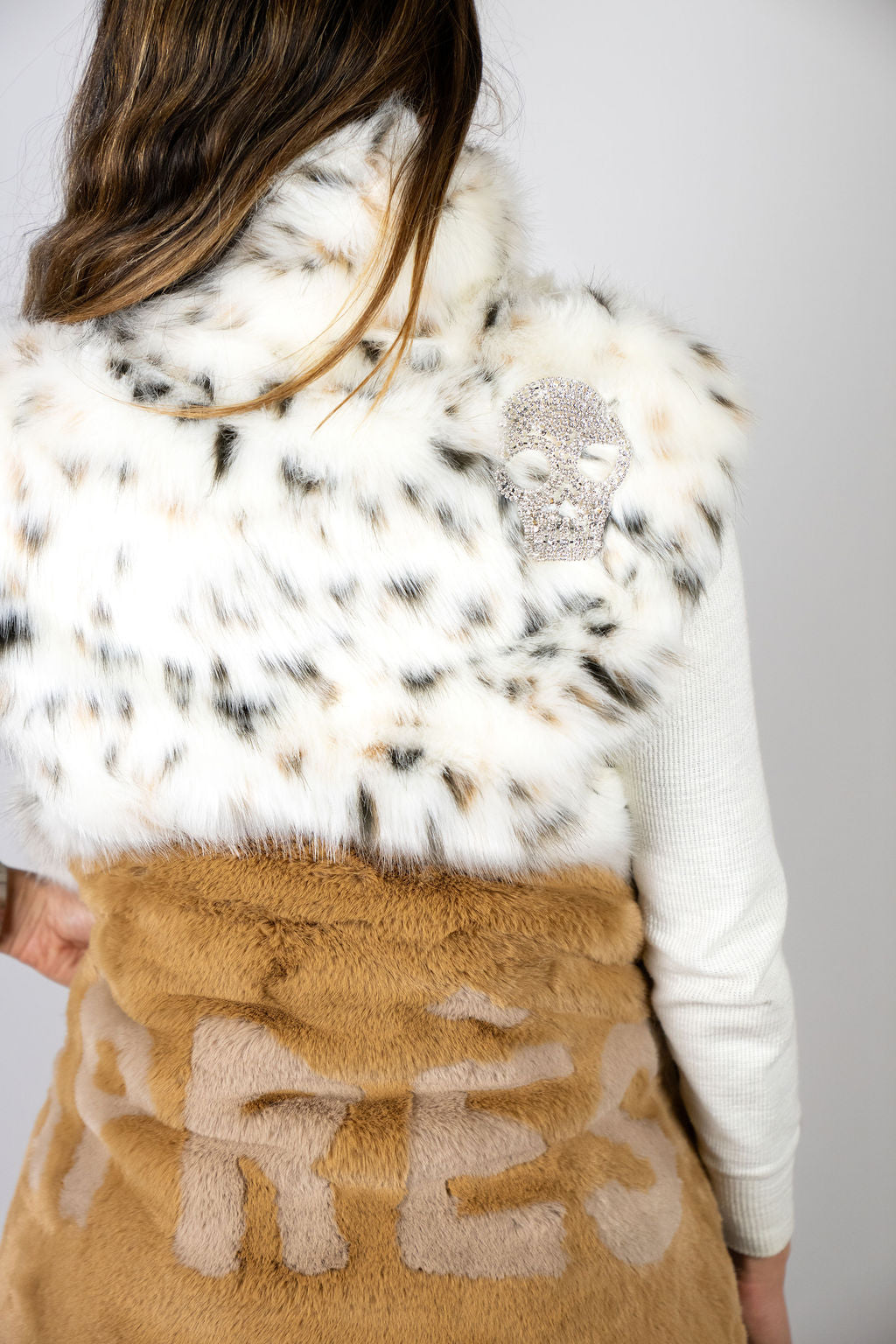 Crystal skull detail styled with the Angel Wings Mr Grey Après Caramel faux-fur coat.