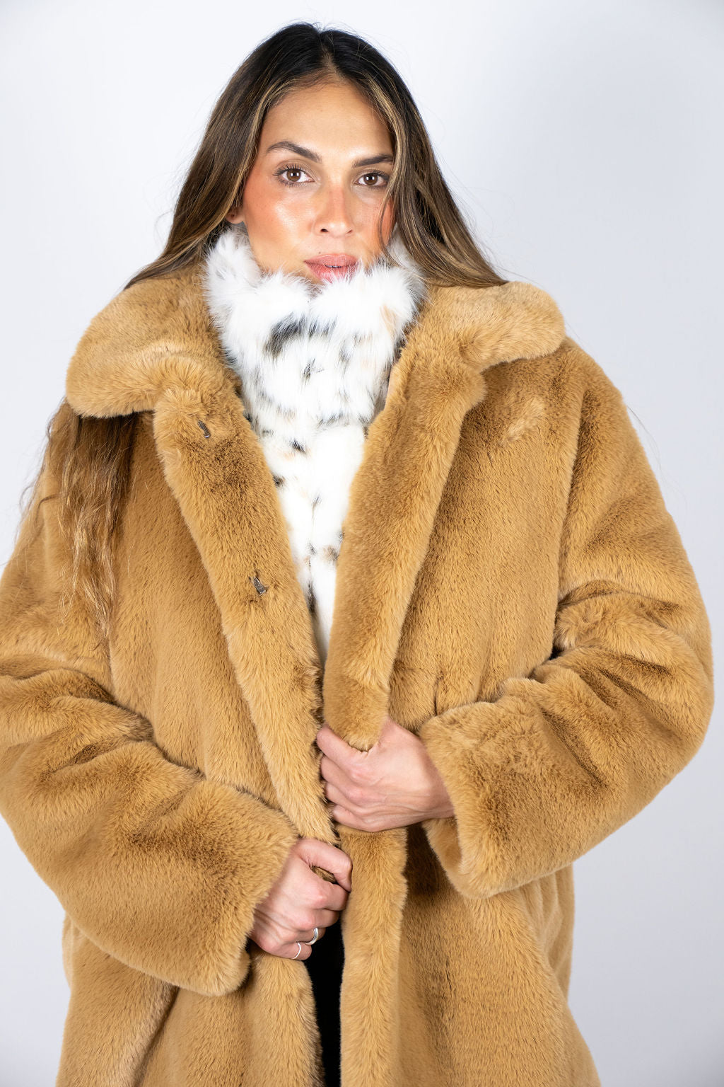 Model wearing the Angel Wings Mr Grey Après long faux-fur coat in Caramel.