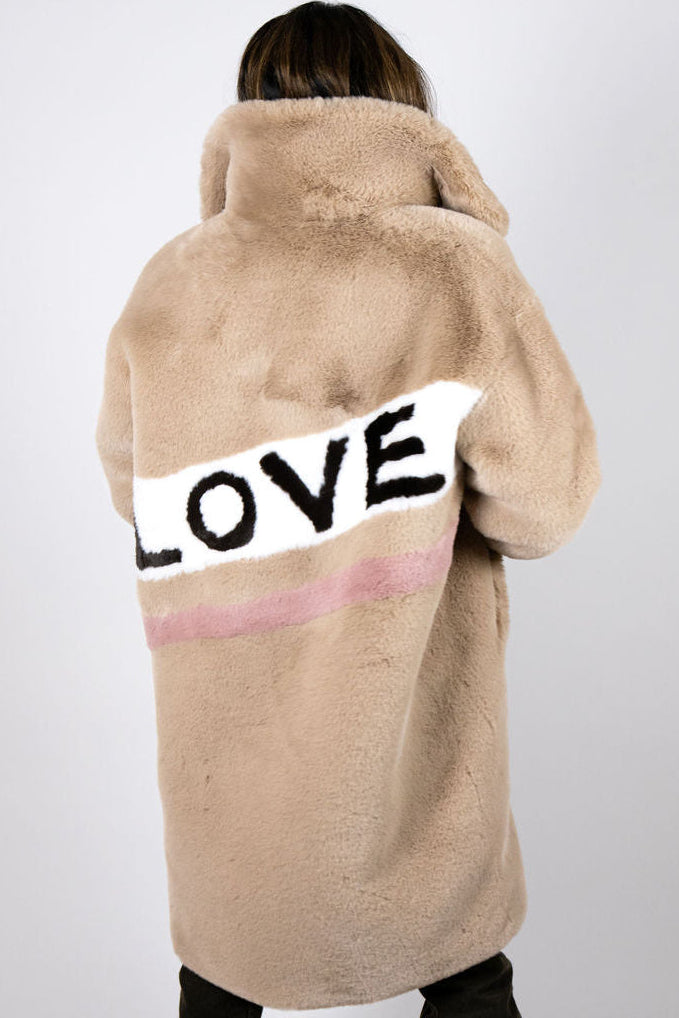 Side view of the Angel Wings Mr Grey Love Beige long faux-fur coat with oversized collar.