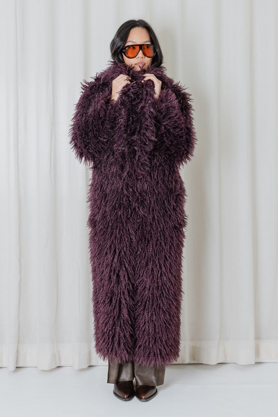 Front view of the Angel Wings Yeti Coat in Bordeaux, a long shaggy faux-fur statement coat.