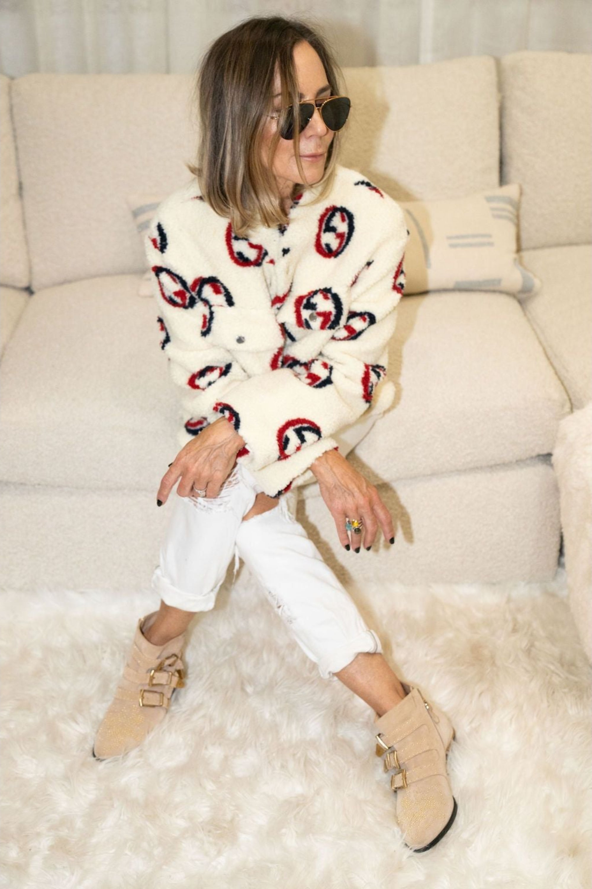 Woman wearing cream faux shearling bomber jacket with red and navy graphic print – Maru Bomber by Angel Wings by Lucy