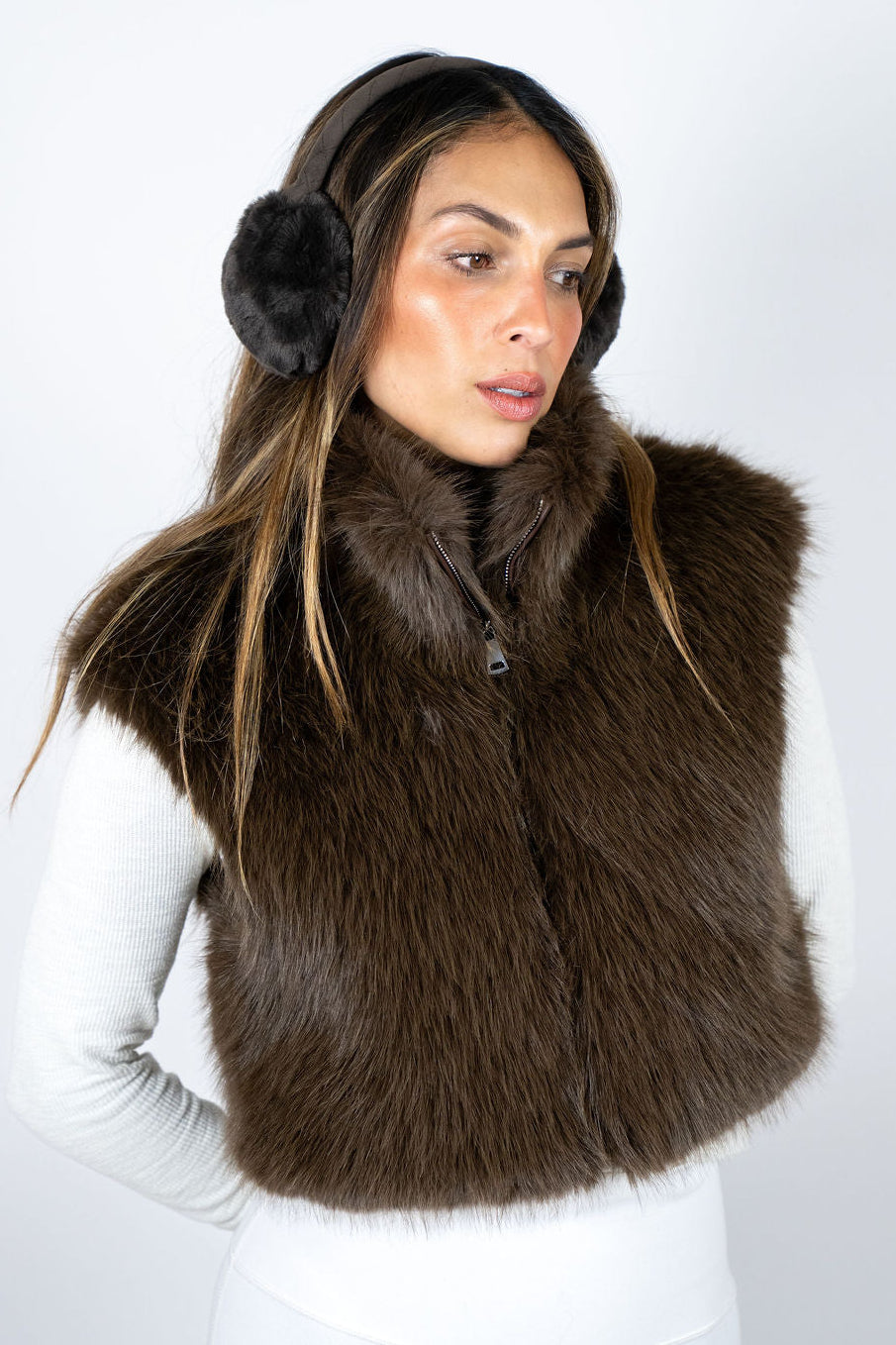 Luxury brown faux fur vest for women styled for après ski fashion