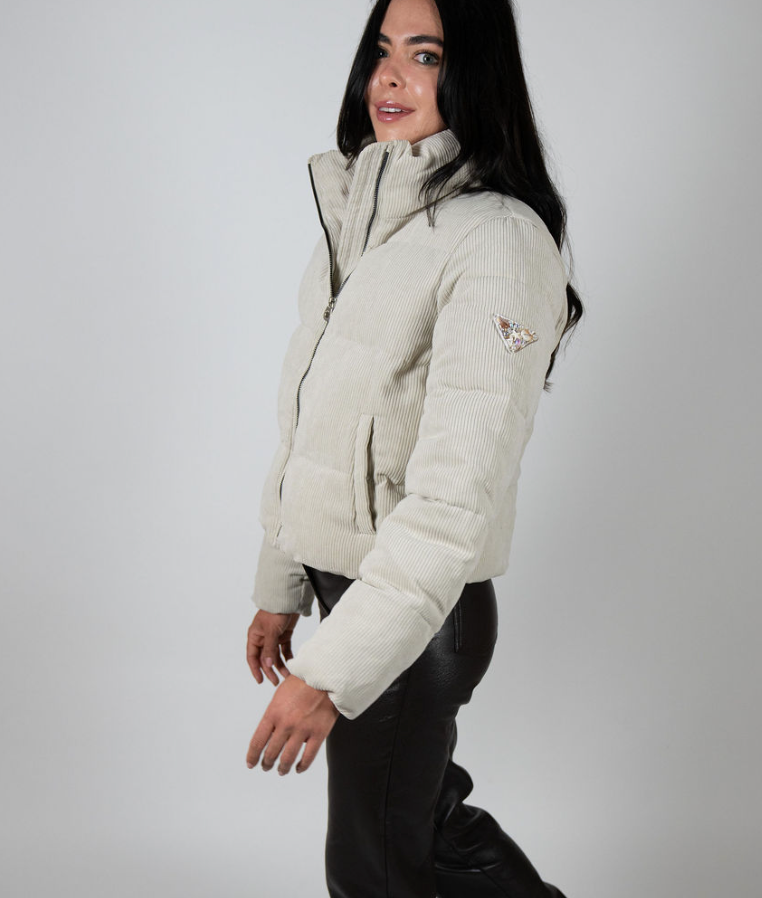 Cream corduroy puffer jacket for women with high collar and signature triangle sleeve patch – Angel Wings by Lucy