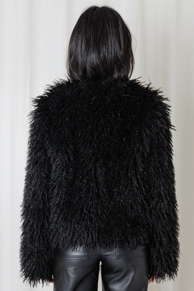 Back view of the Angel Wings Yeti Jacket in Black showing the relaxed silhouette and shaggy faux-fur finish.